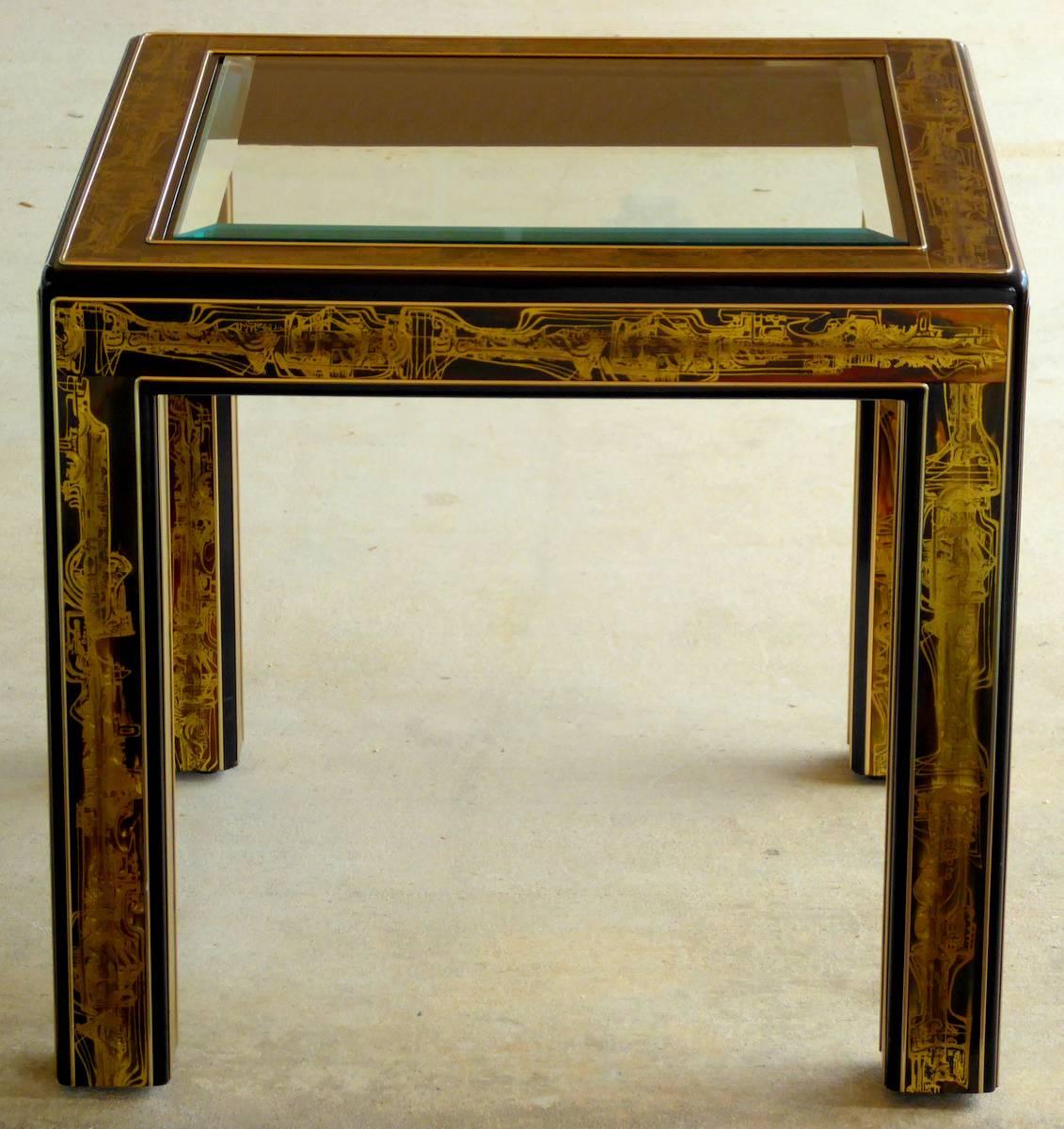 An elegant end table by Bernhard Rohne for Mastercraft. Black lacquered wood with acid etched brass chinoiserie decoration and inset beveled glass top.

Although cocktail tables can be found, we rarely see the end tables.

(Please note: We try