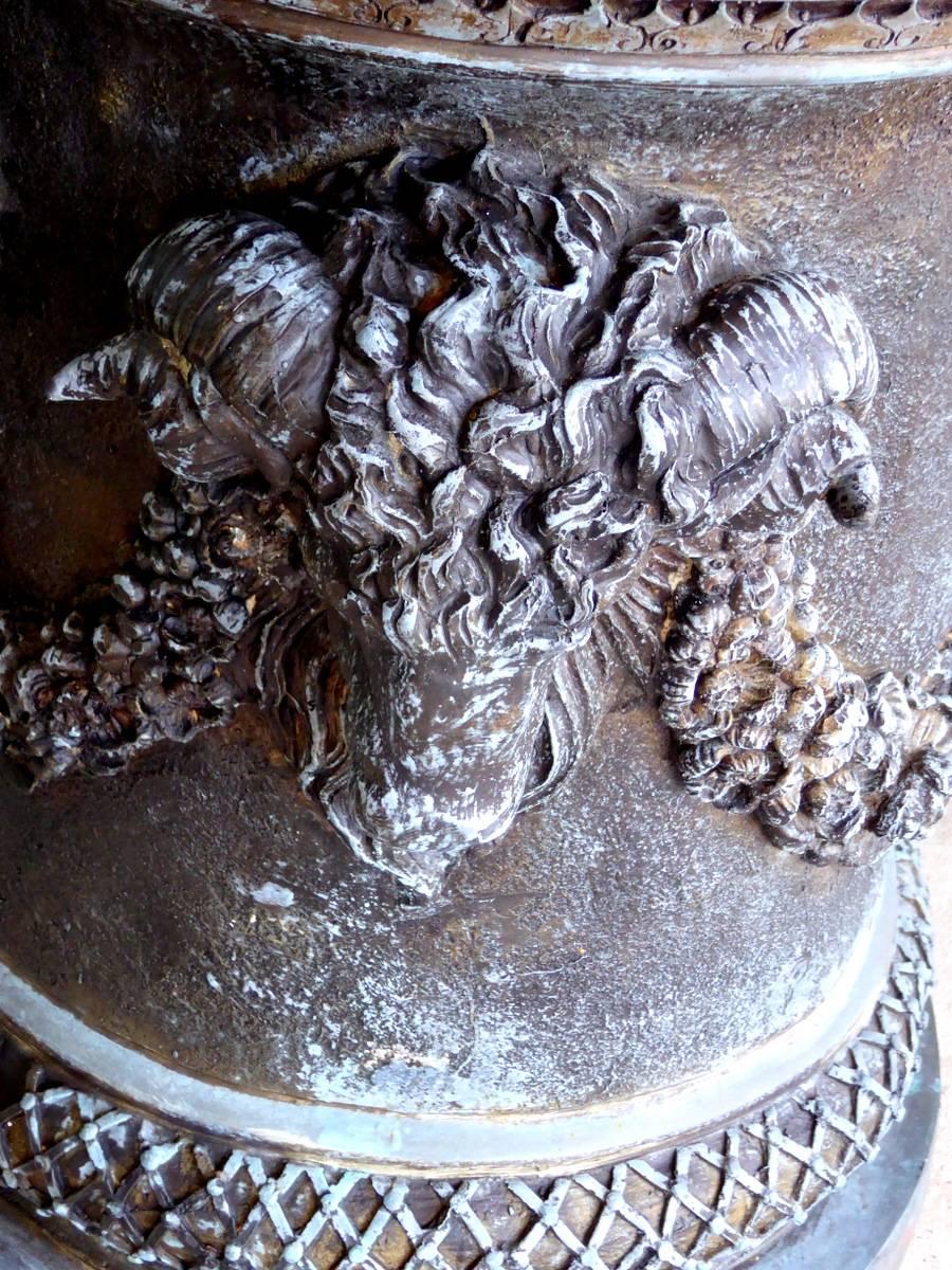 A monumental bronze garden urn, planter, or jardiniere, decorated with three large and four small ram's heads, garlands, leaves, egg-and-dart molding, and other adornments. Complete with rarely seen lid. Magnificent!

A few important notes about all