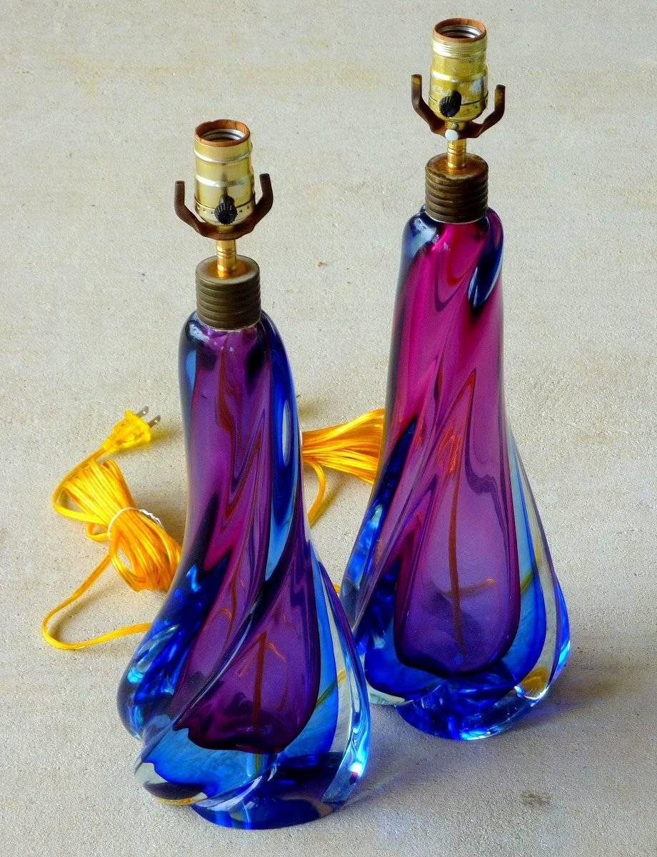 A magnificent pair of Sommerso lamps in violet and indigo encased in clear glass. By Flavio Poli for Seguso of Murano, Italy. Made in the mid-1960s, newly rewired.

(Please see condition notes.)

(Please note: We try to respond to messages within