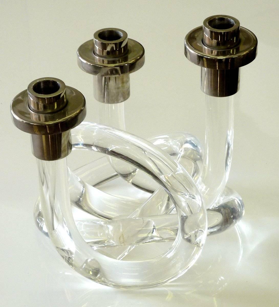 The most elegant candelabra by Dorothy Thorpe. Features interlocking elements of Lucite and nickel.

We have an extensive selection of vintage Lucite. If you are looking for a special piece or a specific designer, just ask.

A few important notes
