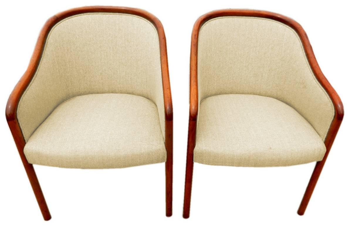 These Mid-Century walnut chairs by Ward Bennett for Brickel graced the lobby of a disgraced savings and loan. Priced individually.

Please note that three of these chairs are upholstered in a beige wool, and the fourth is upholstered in blue damask.