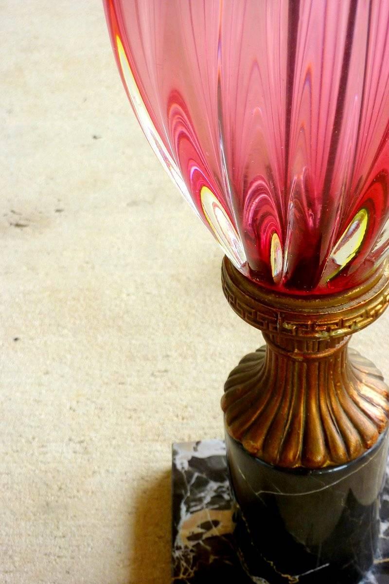 A magnificent lamp in cosmopolitan pink twisted art glass with a black marble base and gold accents. Made by Seguso of Murano, Italy.

Measured to the top of the socket, as pictured. We can supply a harp and finial, if requested when you place your