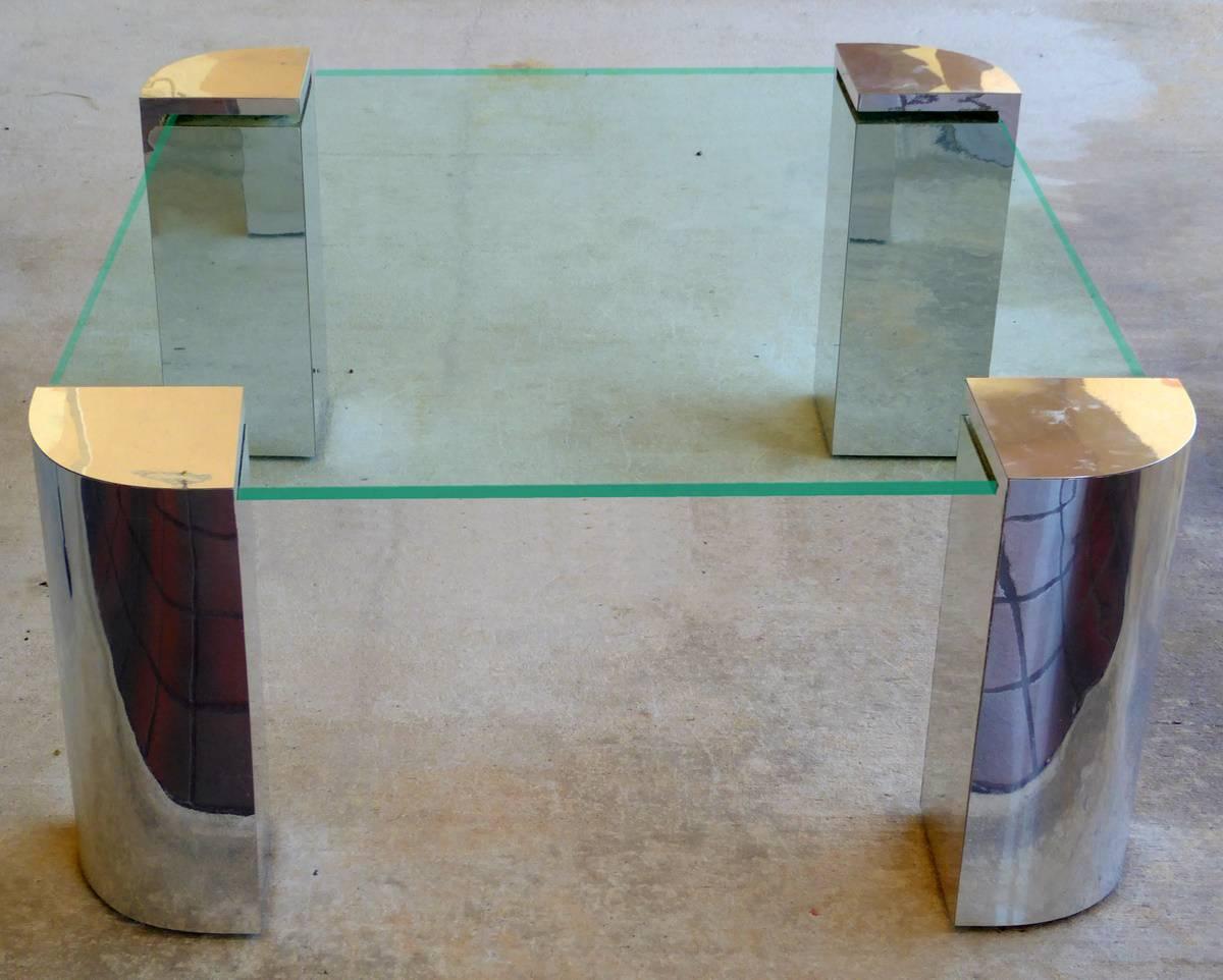 A rare cocktail table consisting of four quartered posts of chrome-plated steel polished to a mirror finish supporting a heavy glass top. Evokes the best designs of Leon Rosen and Karl Springer.

(Please note: We try to respond to messages within