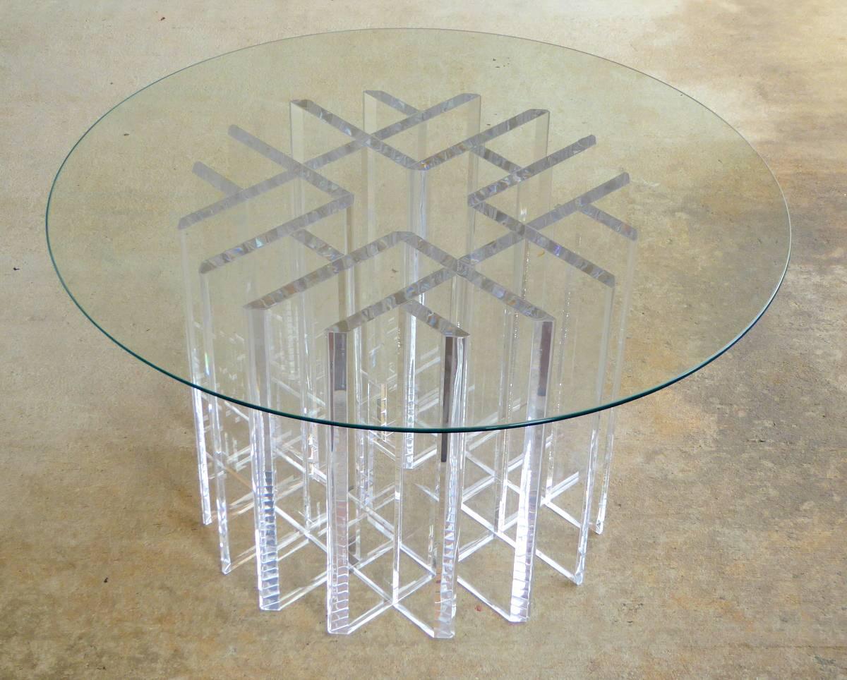 A sparkling Lucite cocktail table with an intricate interlocking design.

Shown with a 30