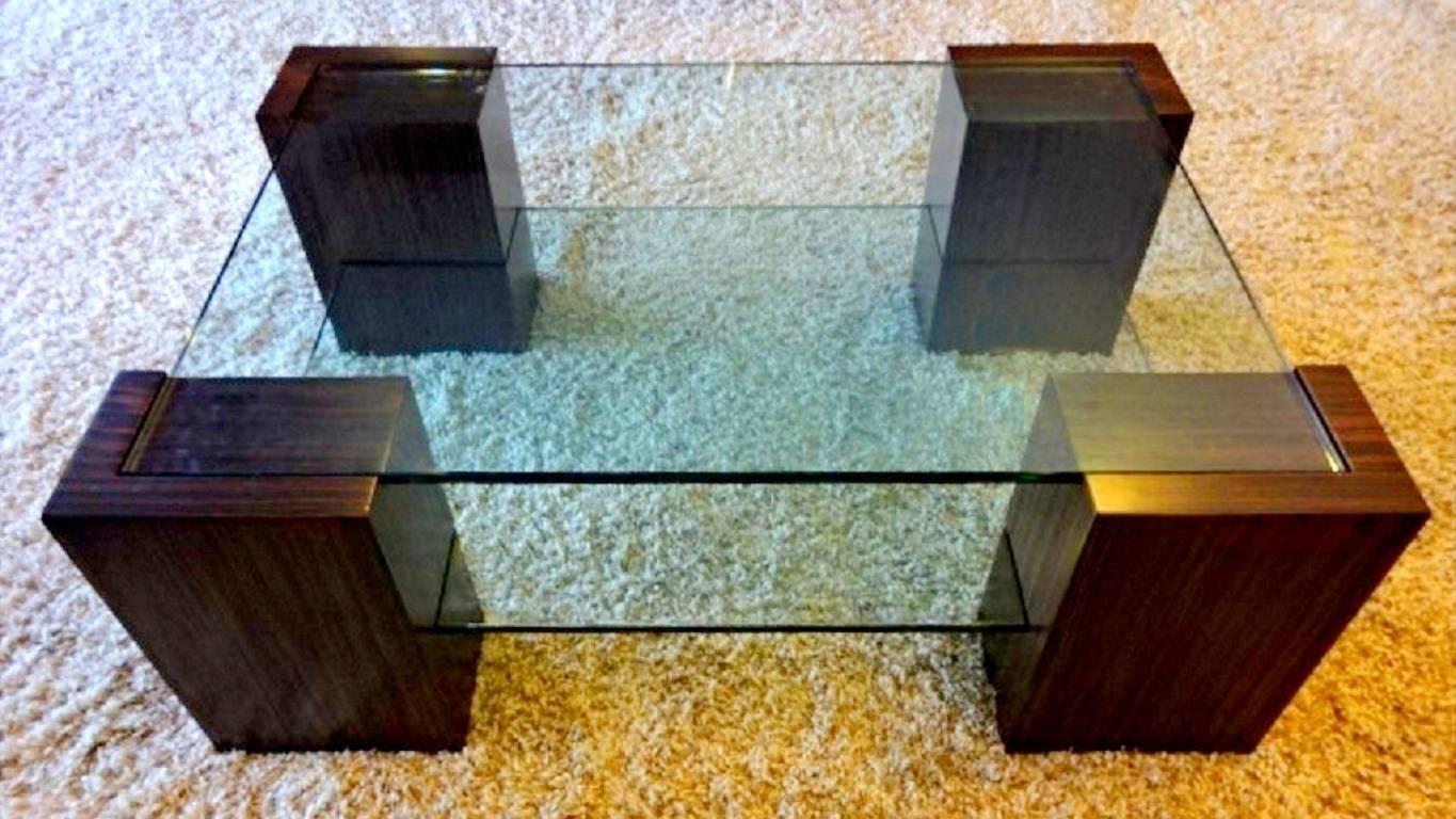 An exceptional cocktail table with ebony corners supporting two thick slabs of glass. Impressive!

A few important notes about all items available through this 1stdibs dealer:

1. We list all our items as being in 