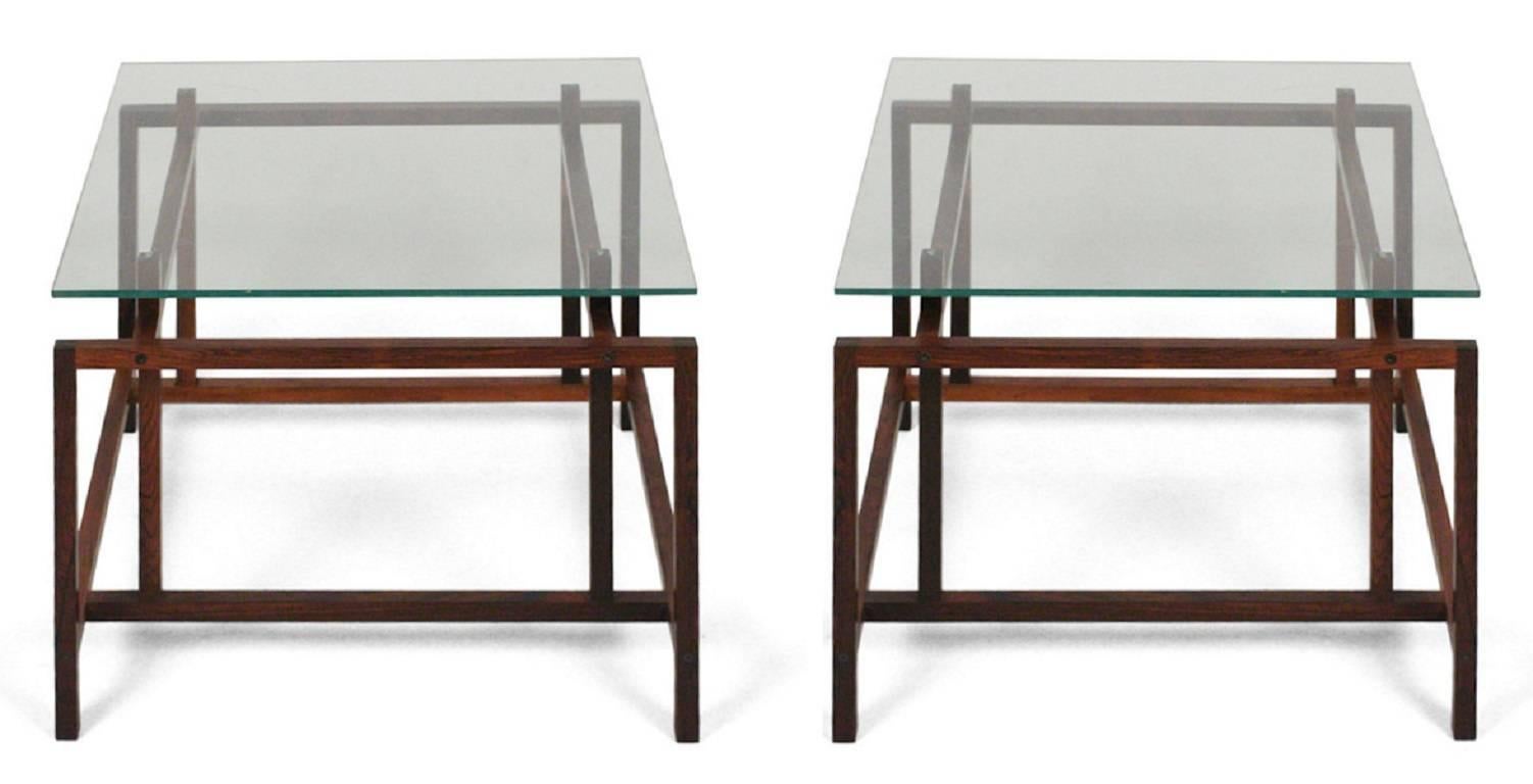 This pair of solid rosewood side tables by Henning Norgaard for Komfort is so delicate but so delightful.

We have replaced the tops with glass made to look just as the originals did.

A few important notes about all items available through this