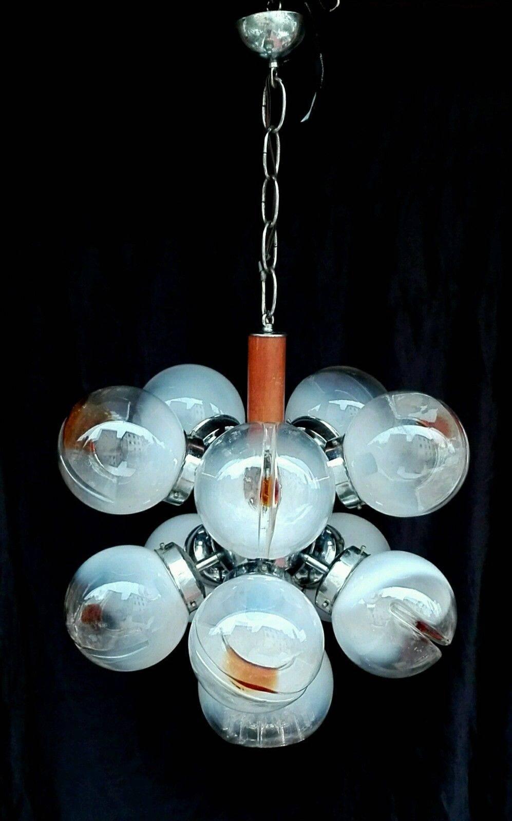 A stunning Sputnik style chandelier with 11 art glass globes in various designs. Made by Mazzega of Murano, Italy.

Height measurement does not include the chain.

A few general notes about all items available through 1stdibs dealer MOBLER  Home