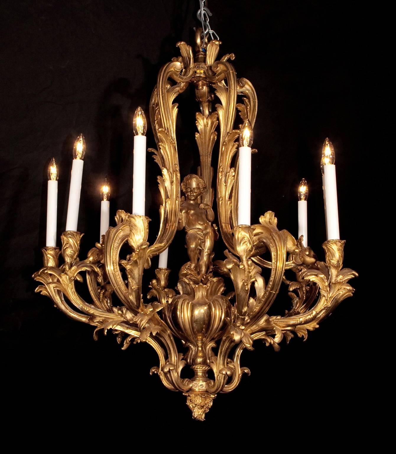 This exquisite French 19th century Napoleon III chandelier features an intense and beautiful bronze d’ore. The piece is adorned with acanthus leaves; note the movement on the arms, growing to the top, and the flower bulb like candle cups. Lastly, a