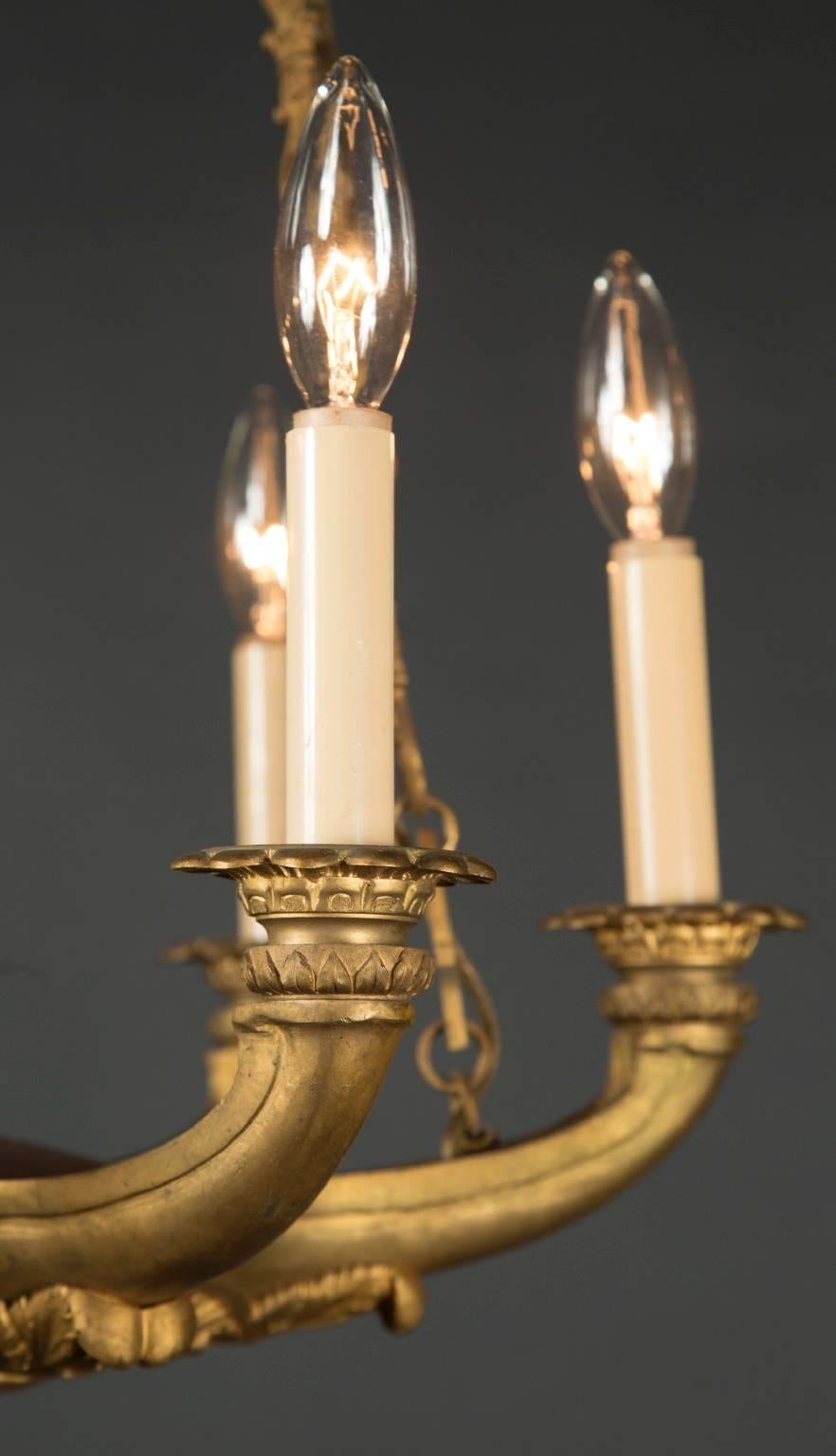 French 19th Century Empire Bronze Chandelier with Palmetto Crown and Flame Center For Sale