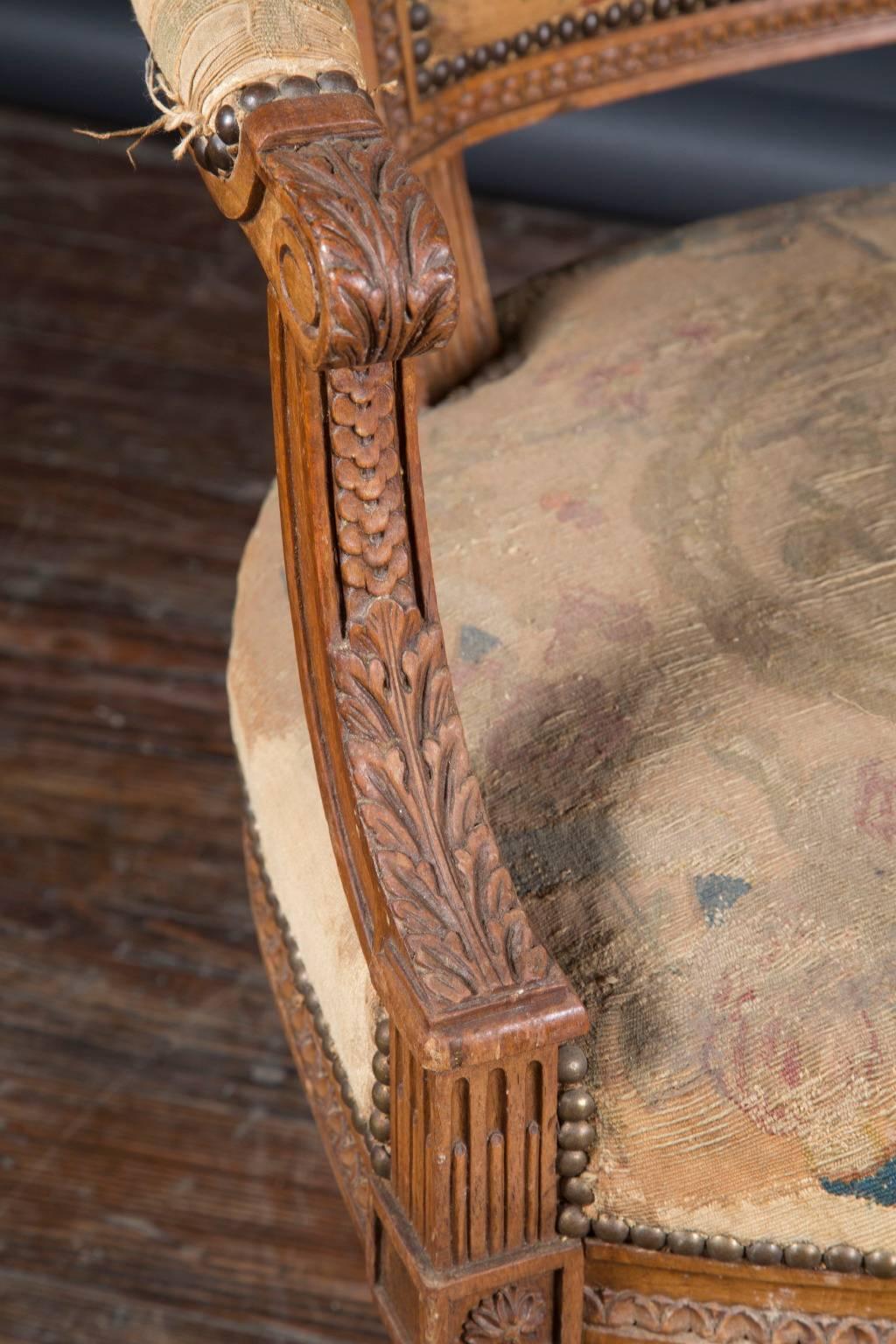 19th Century Pair of 19th century Louis XVI Walnut Armchairs with Original Petit-Point For Sale