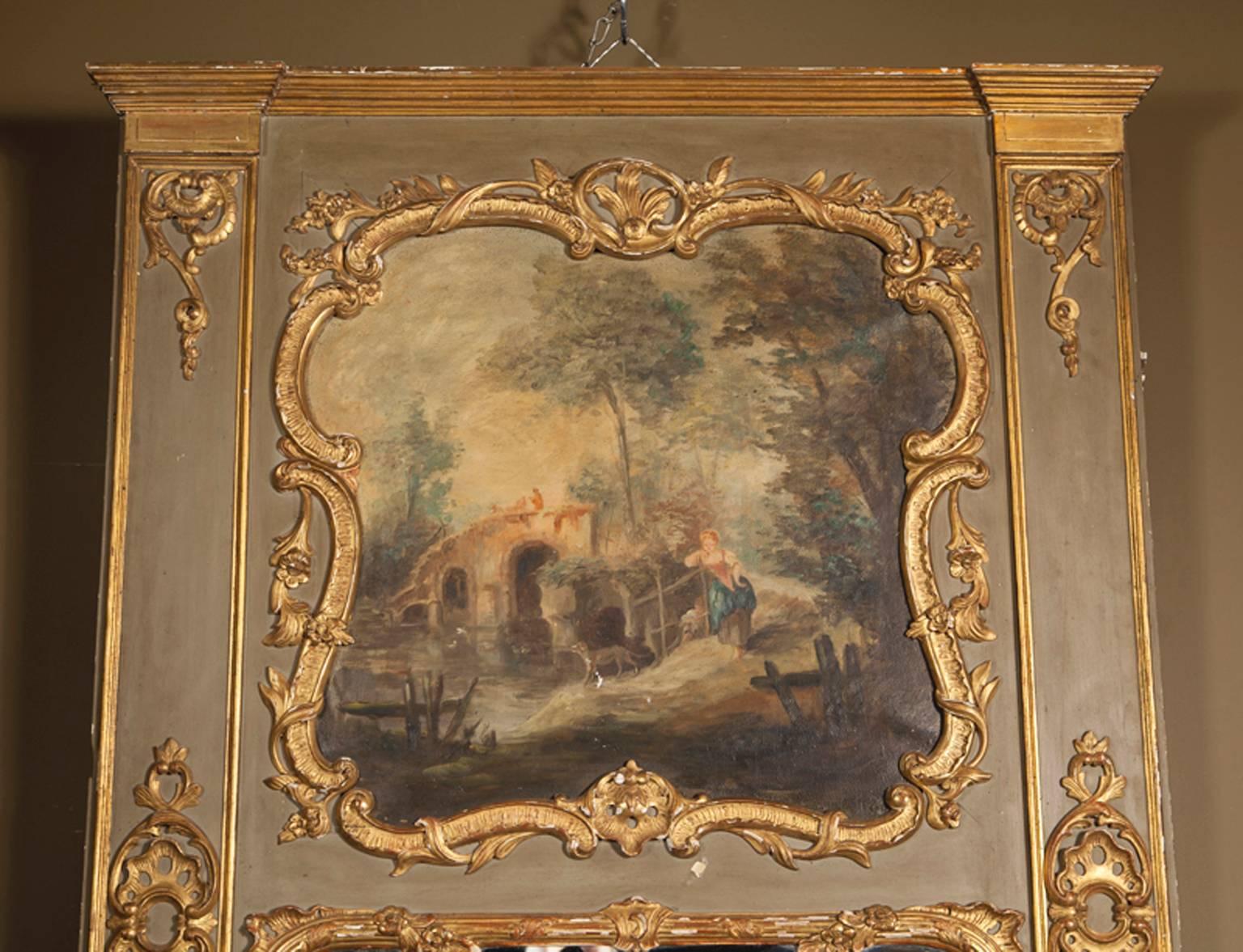 This antique trumeau, carved in the manner of Louis XVI, is oil-painted with a scene of French pastoral life in the top third, above the mirror. A barefoot French country-girl leans against a wood post fence while her dog stands on the bank of a