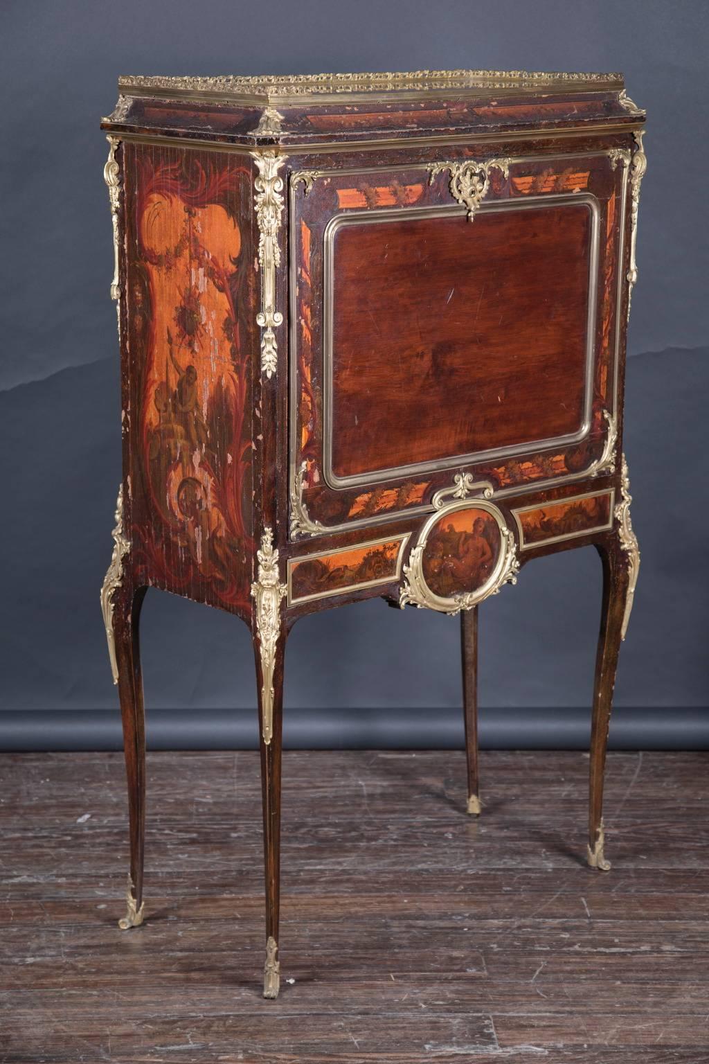 This secretary desk opens up and offers a beautiful writing space, along with areas to store your writing material. The secretary has bronze mounts, a marble top and Venis Martin decorations on the front, side, and legs. The interior of the