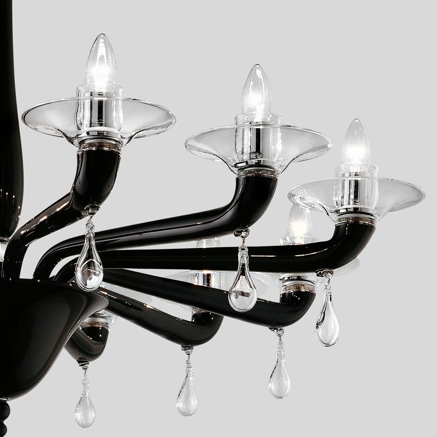 Twelve-light Venini Classic chandelier in handmade blown glass.
Re-edition of an historical chandelier designed in 1924.
Lighting source: 12 x max 60W E14
Color: black with crystal decorations
Metal: chromium-plated with chain
Weight: around 20