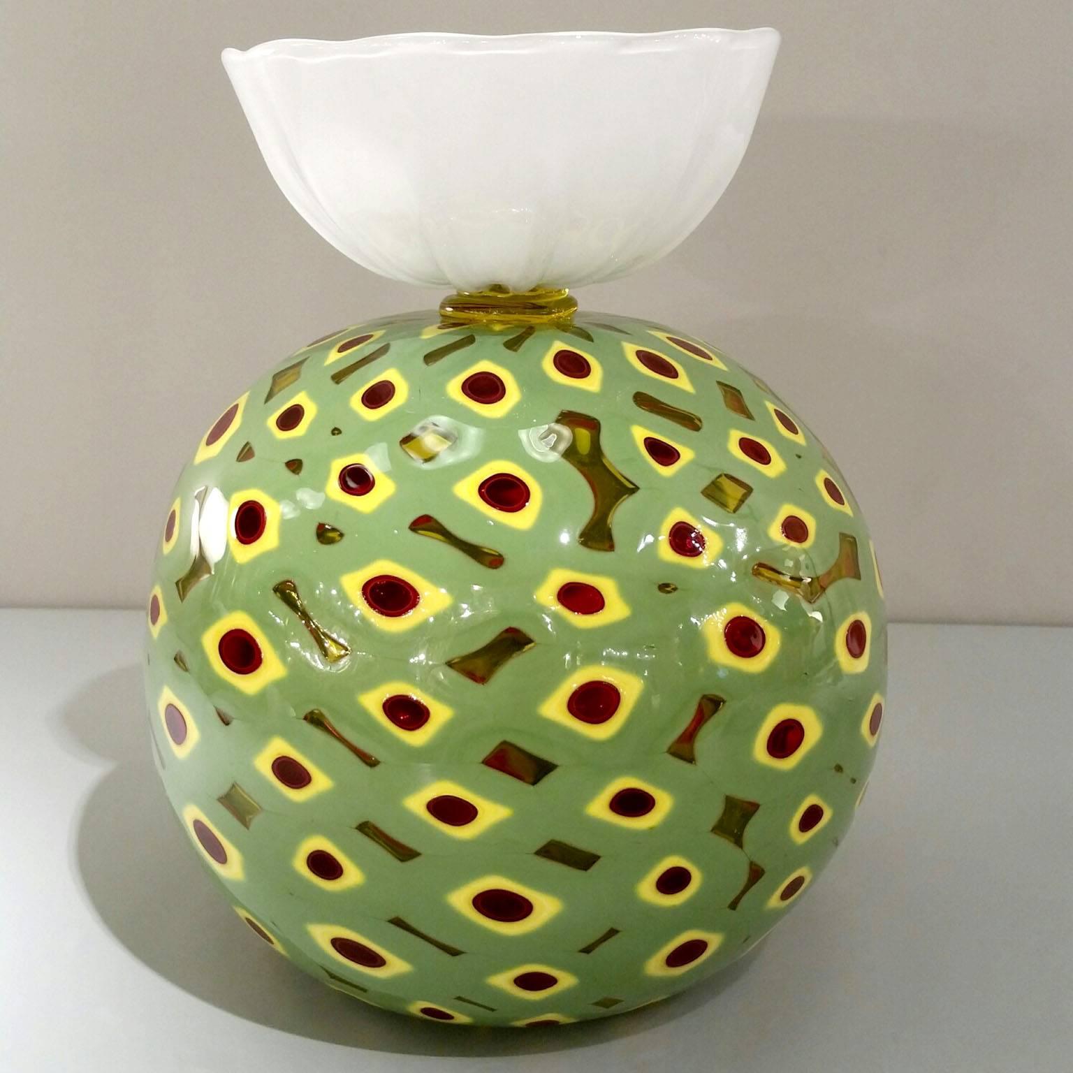 This unique piece belongs to a very famous series designed by Flo Perkins for Venini in 2007
Blown handmade glass sculpture in yellow and glass green color.
Multicolored 