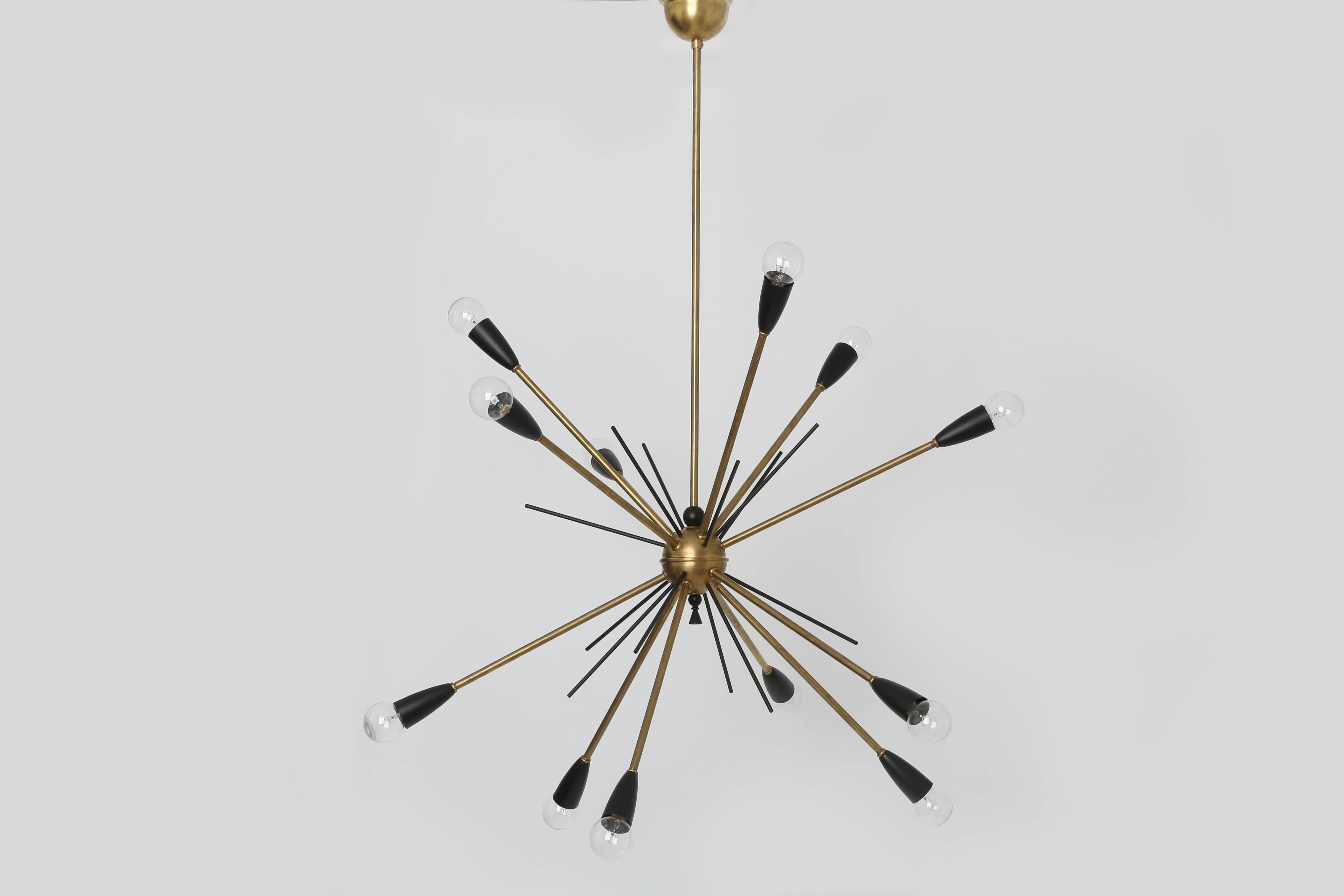 French Sputnik chandelier made out of brass with 12 brass arms, circa 1960s.
Brass has beautiful warm patina.