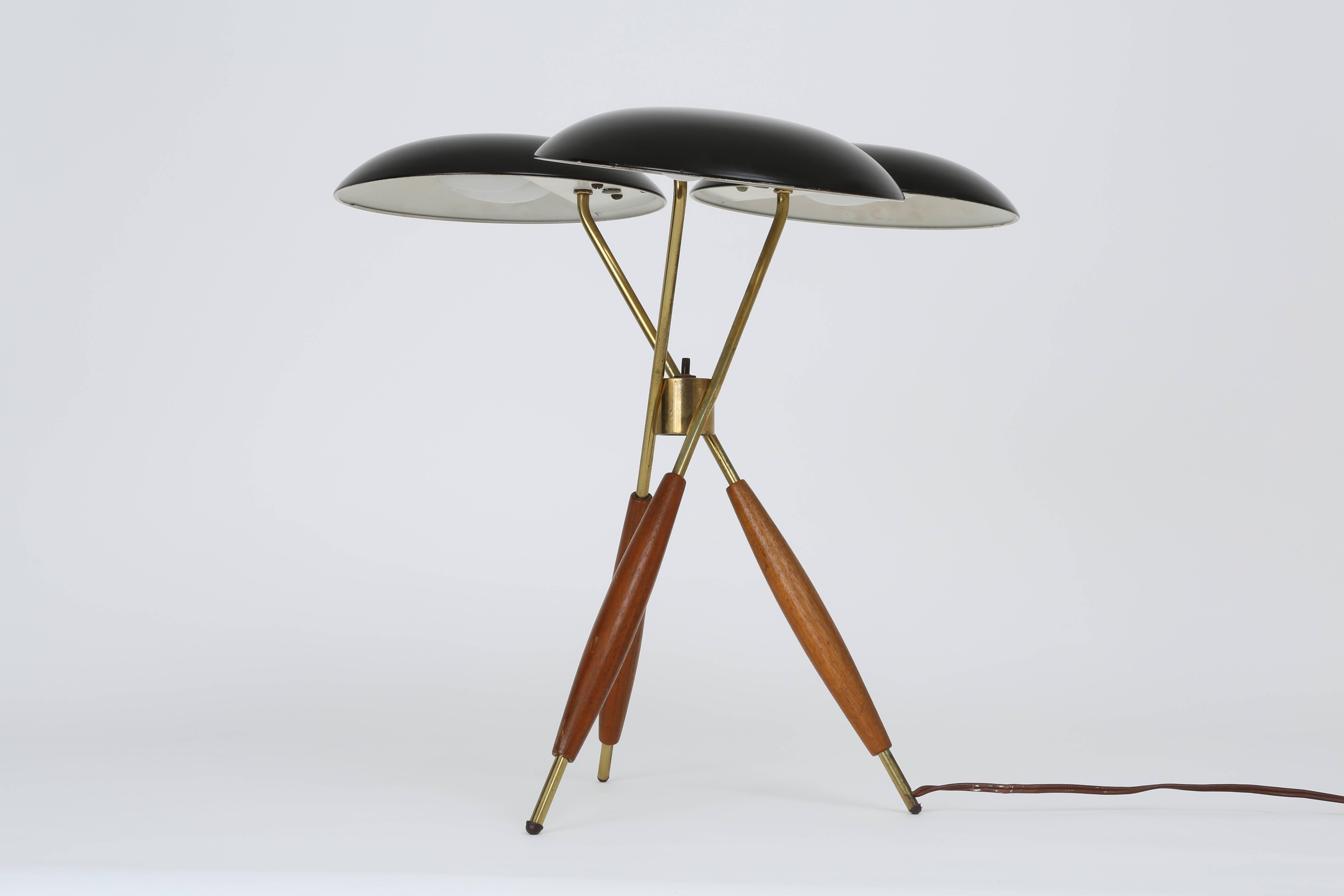 Gerald Thurston table lamp for Lightolier.
Made with brass, walnut and enameled metal.