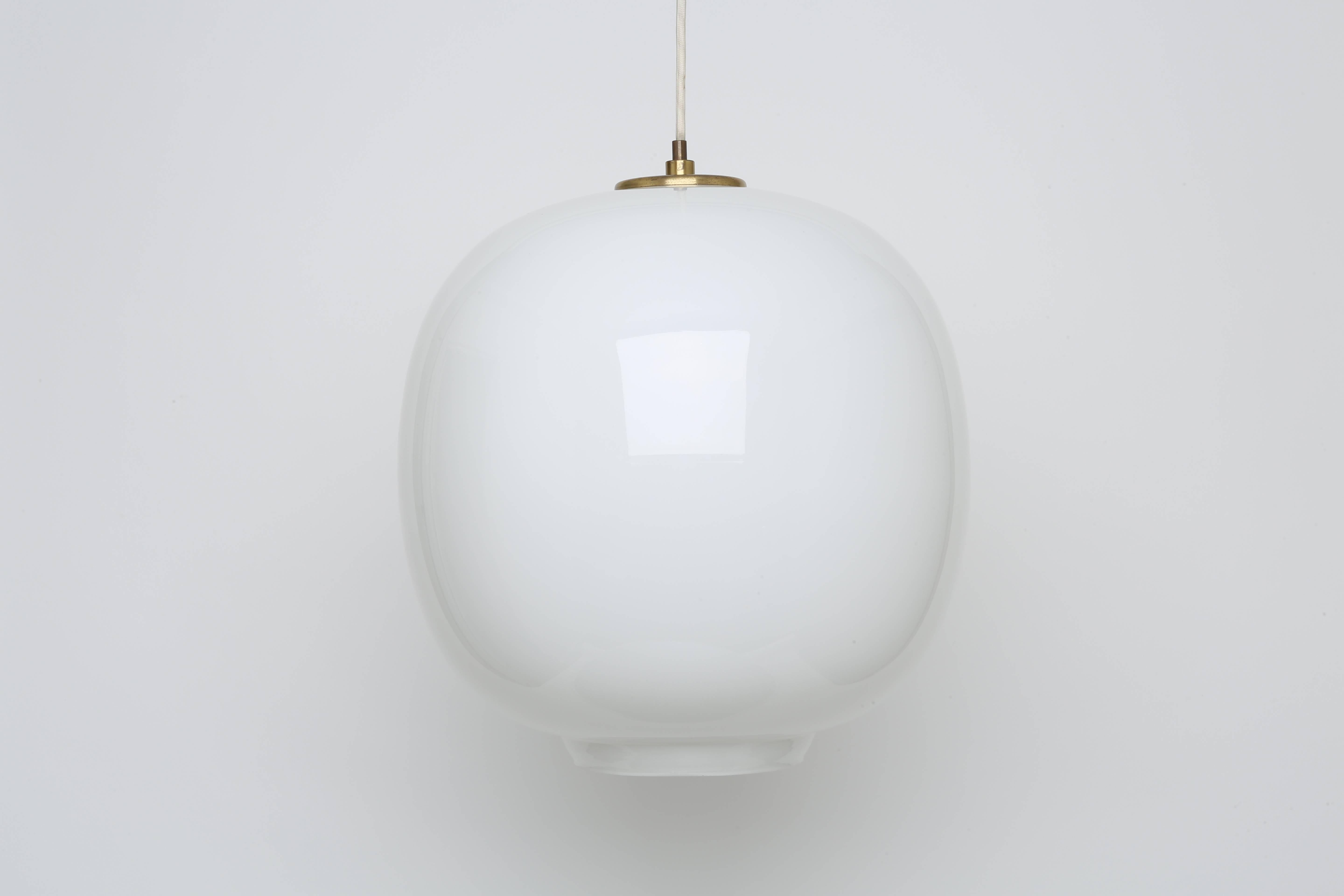 A pair of ceiling pendants by Danish architect Vilhelm Lauritzen.
These pendants were made in three different sizes. This is the largest size with 14.75 inches in diameter.
Vilhelm Lauritzen designed these pendants for Radio House in Copenhagen.