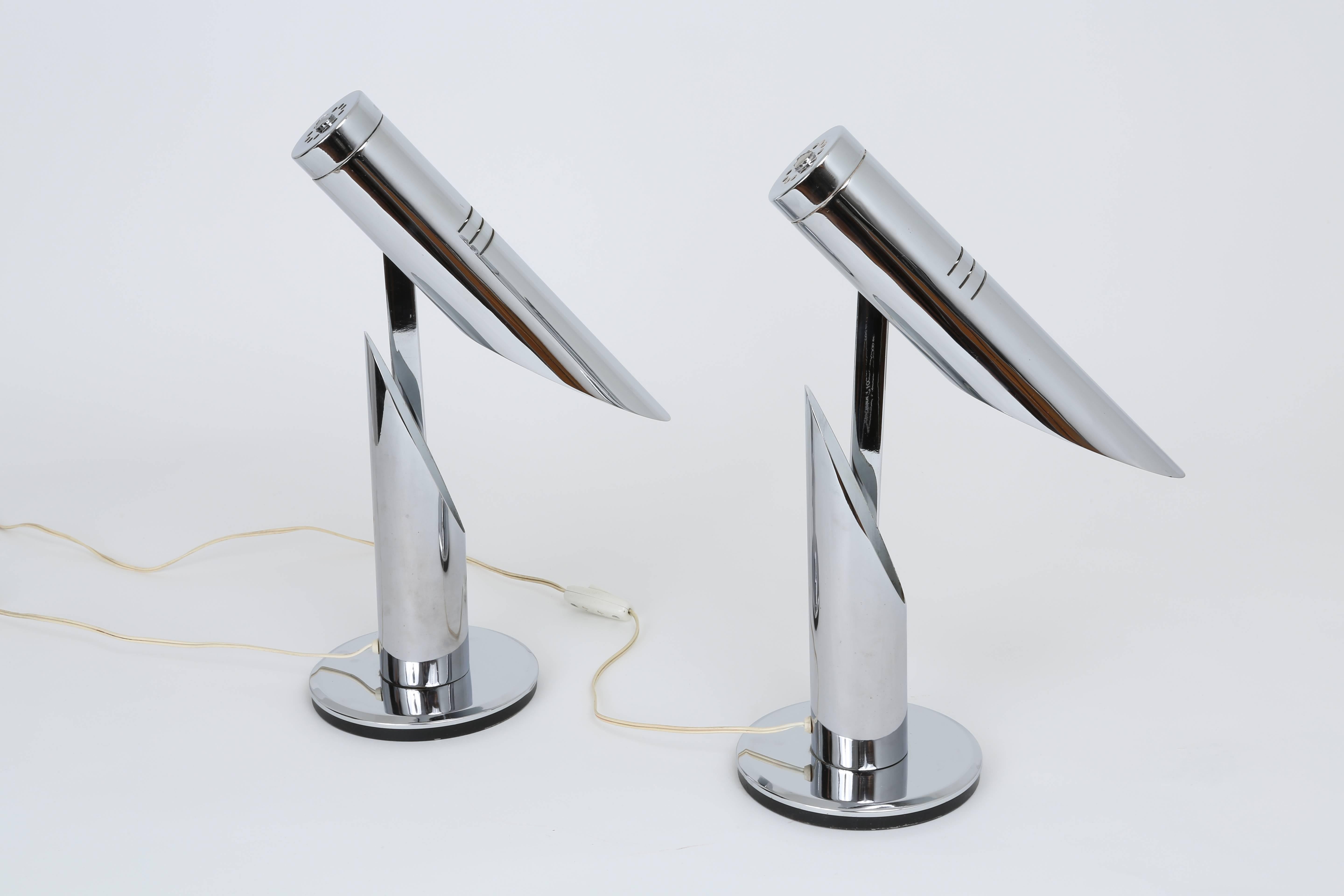 A pair of chrome table lamps by Fase. 
Chrome and enameled chrome inside the shades.