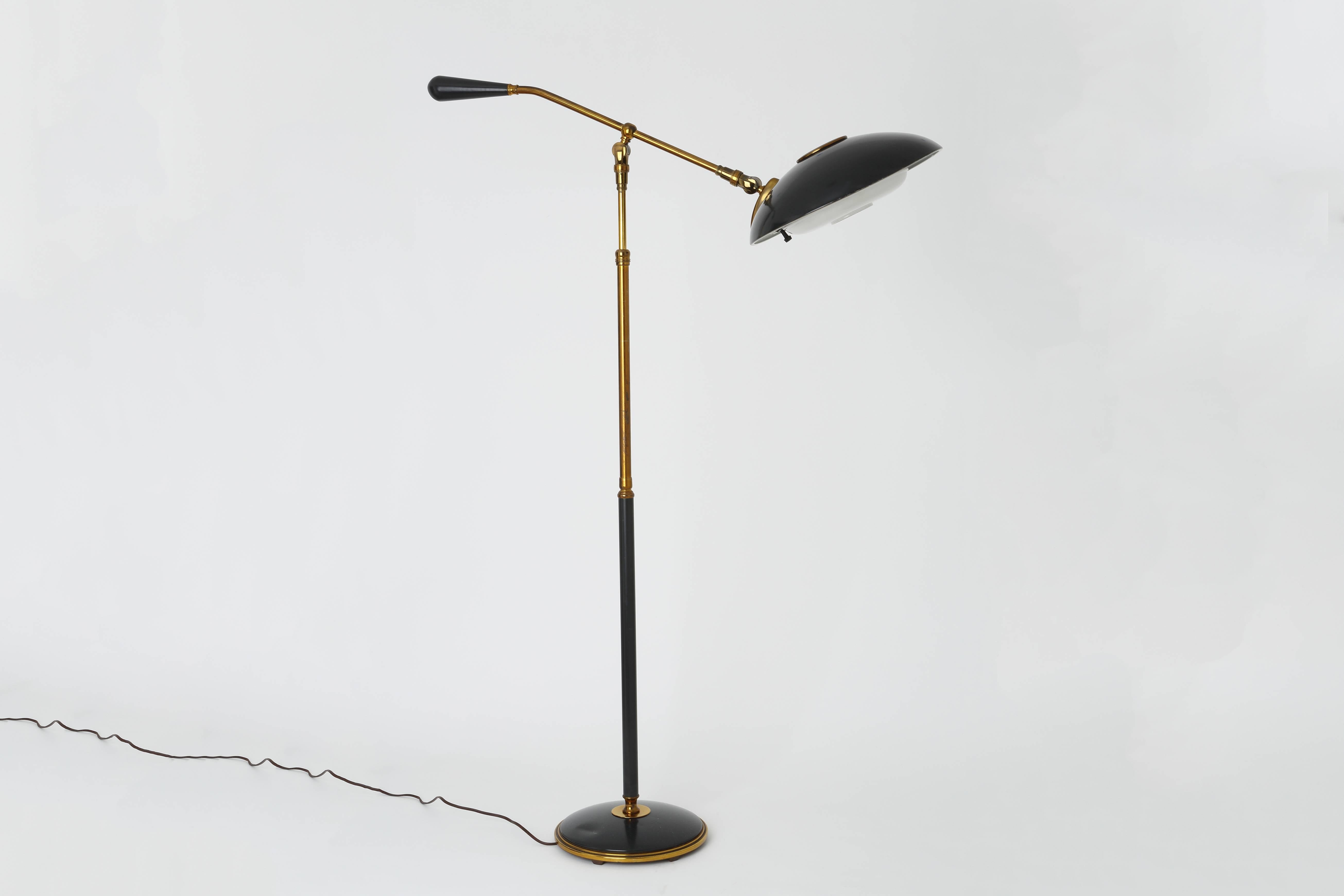 Gerald Thurston floor lamp for Lightolier.
Made out of brass, enameled metal and perforated metal.
Pole extends to 52 inches. Shade swivels in all directions.
 