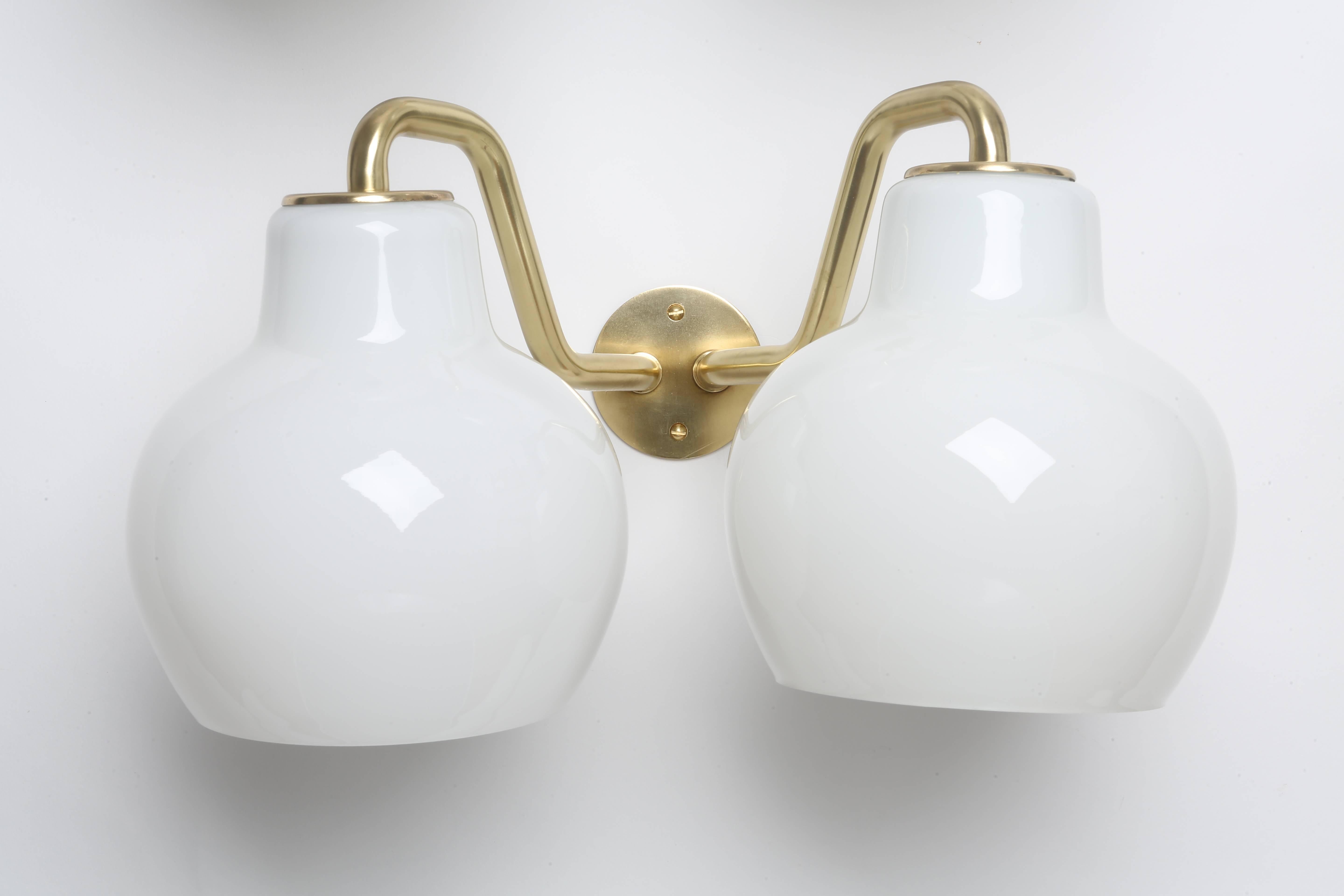 A pair of wall lamps designed by Danish architect Vilhelm Lauritzen in 1950s.
Made with brass and opaline glass.

Matching chandelier and ceiling pendants by Vilhelm Lauritzen are also available.