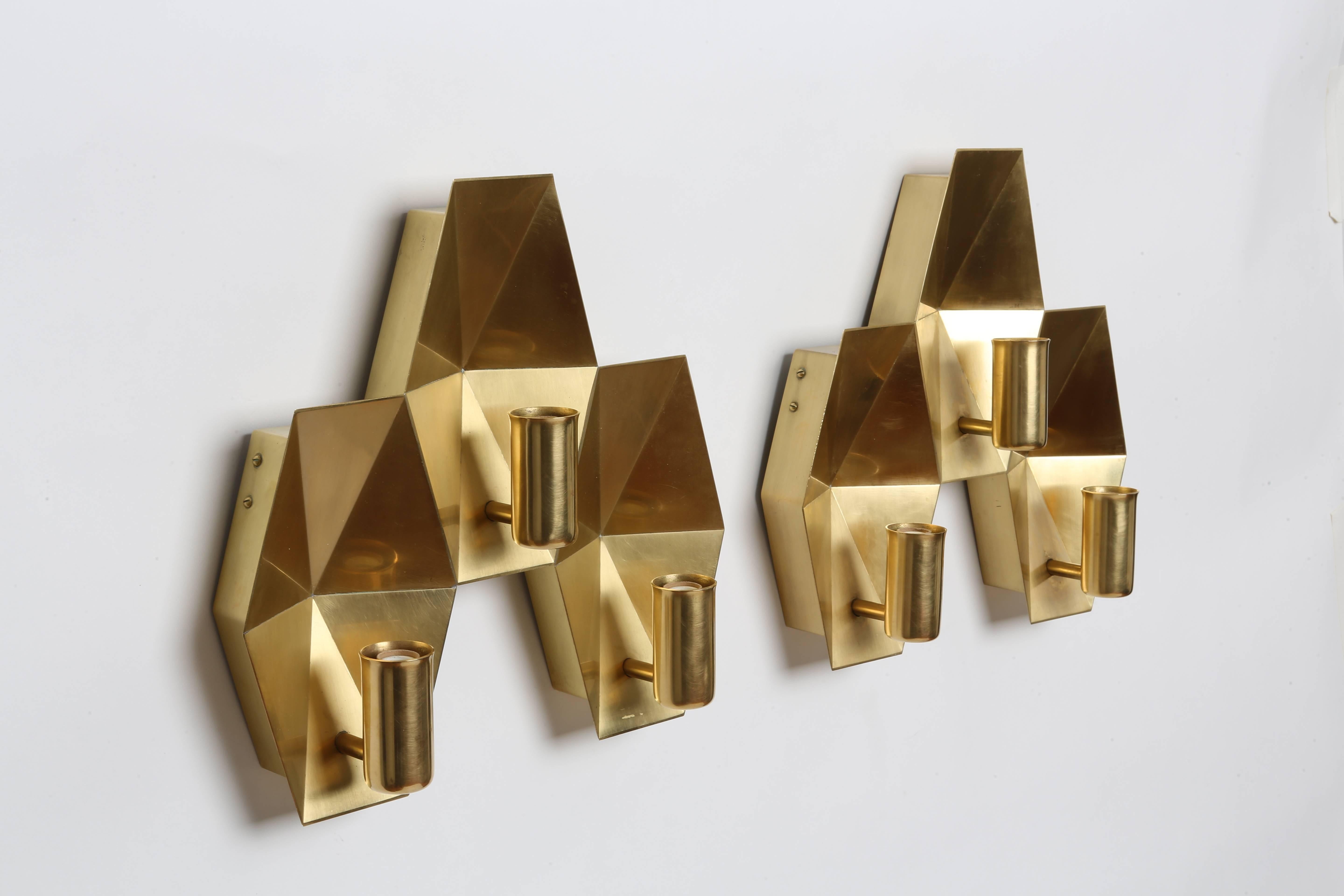 Fog & Morup brass wall lamps. 
Three candelabra sockets each. Made with solid brass.
Denmark, 1960s.