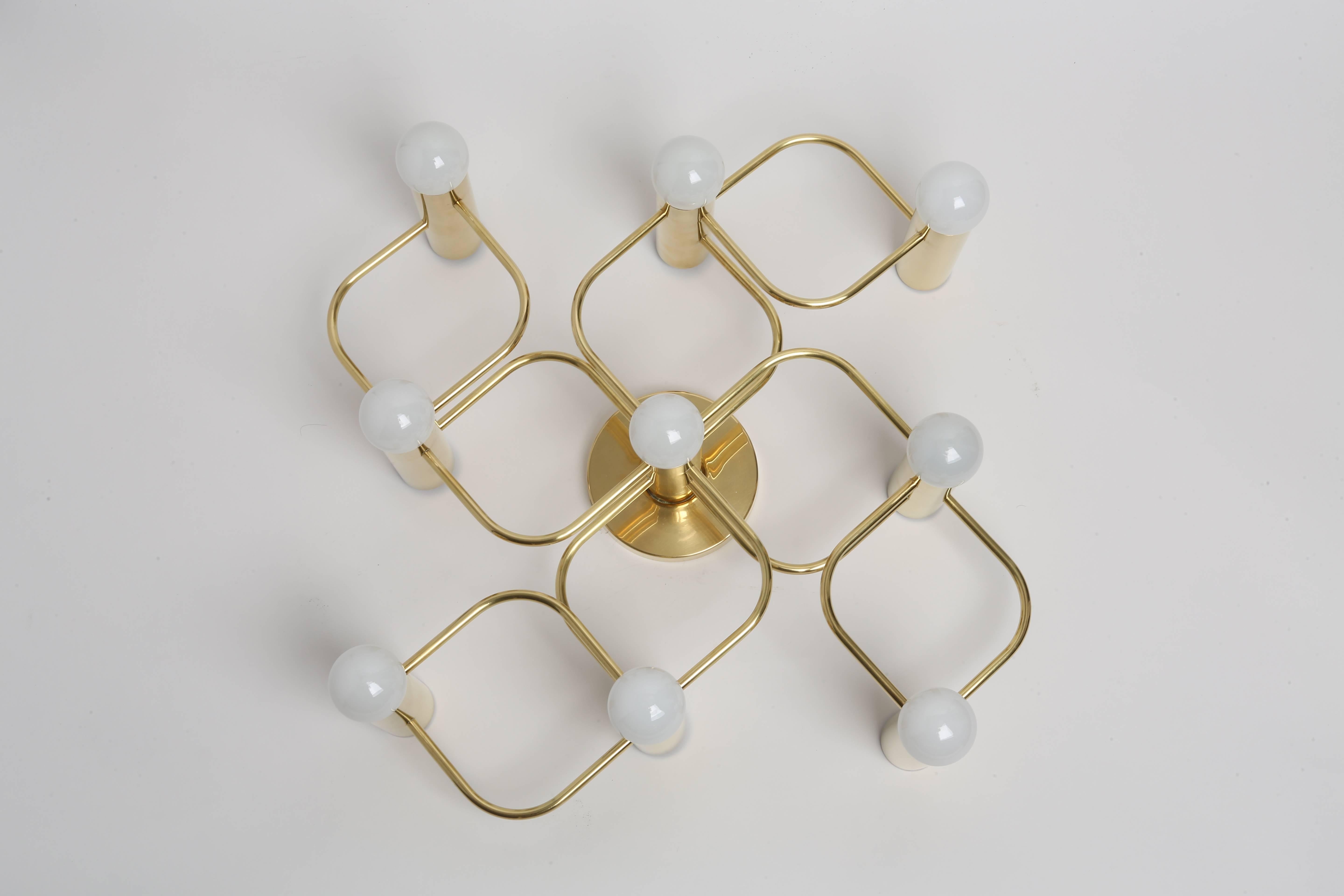 Sciolari style flush mount by Leola in polished brass.
Nine candelabra sockets. Can be used as either ceiling or wall light,
Germany, 1970s.