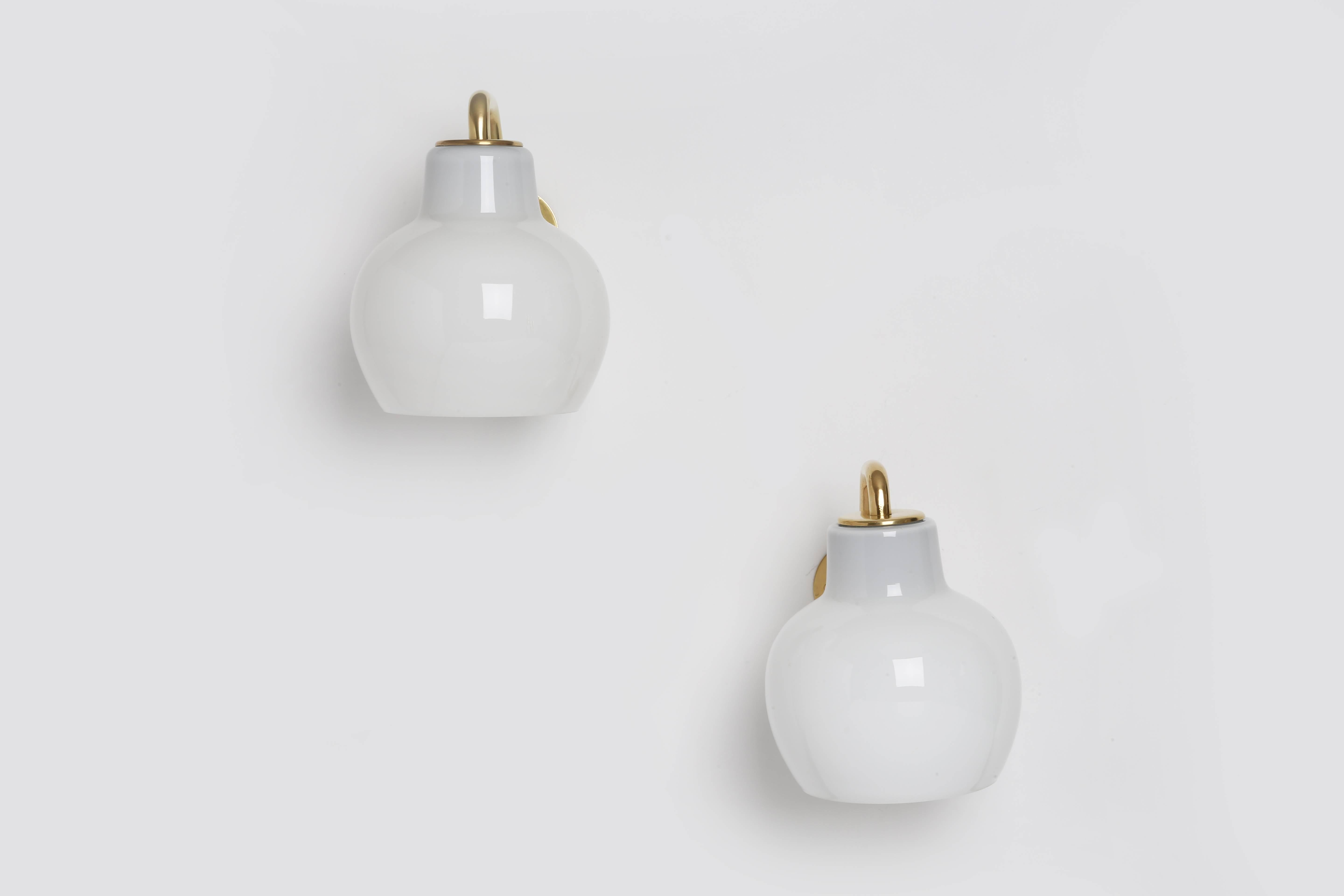 Wall lamps by Vilhelm Lauritzen.
Designed by Danish architect Vilhelm Lauritzen in 1950s for Louis Poulsen.
Made with brass and handmade opaline glass.

Two pairs are available as well as matching chandelier.