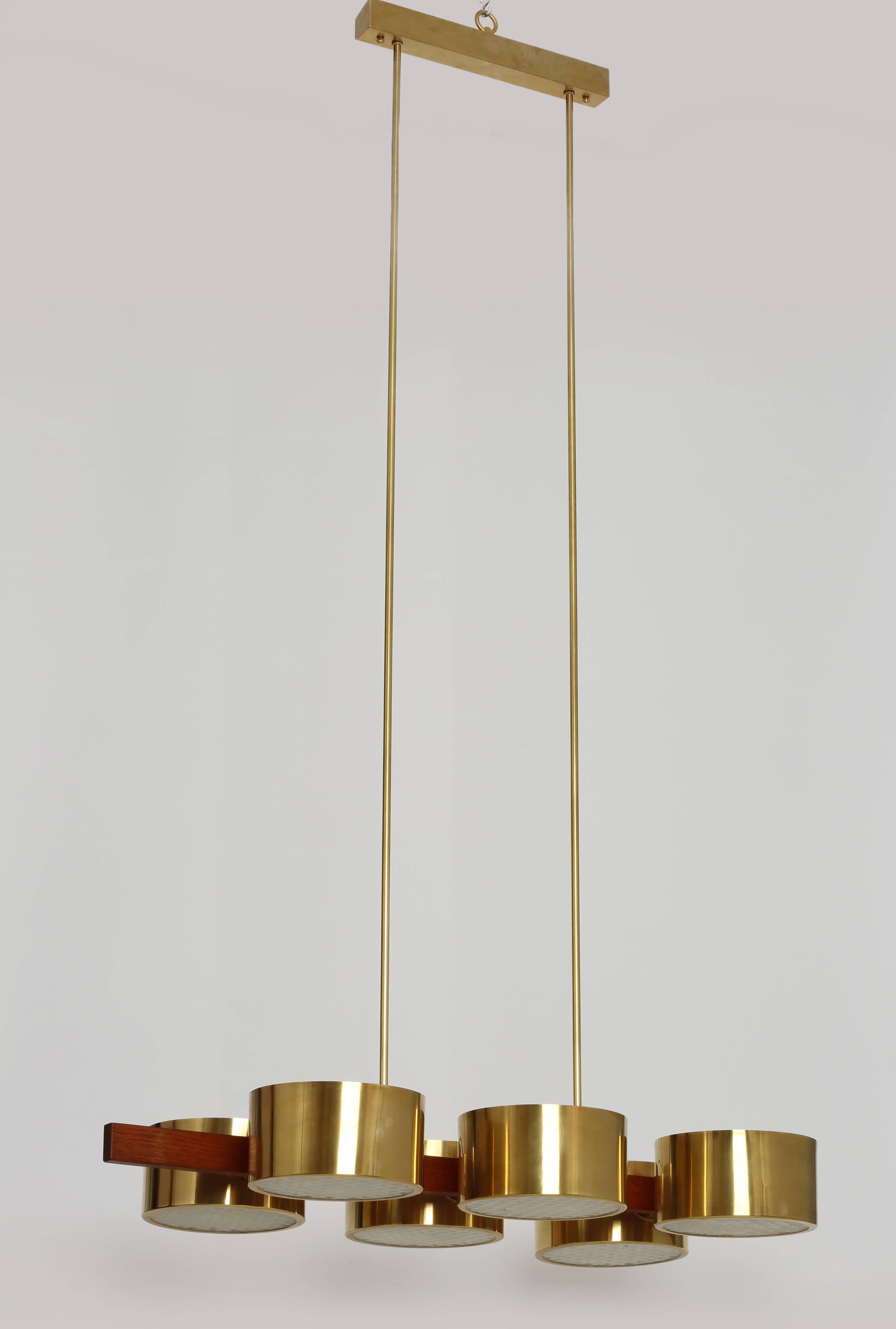 Hans Agne Jakobsson ceiling light. Made of brass and teak with acrylic diffusers.
Label 