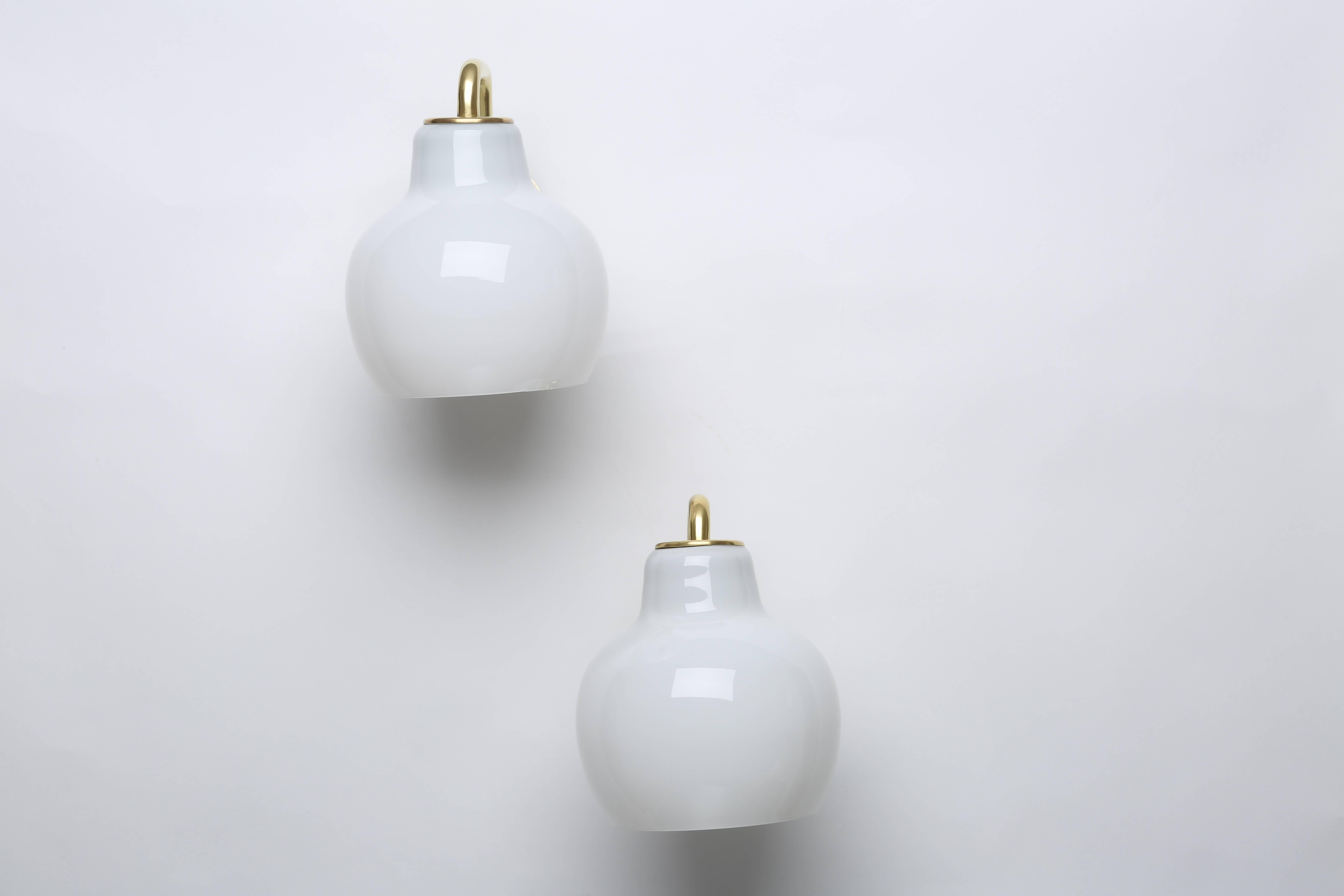 Pair of Vilhelm Lauritzen wall lamps.
Designed by Danish architect Vilhelm Lauritzen in 1950s for Louis Poulsen.
Made with brass and handmade opaline glass.

Matching chandelier is available.