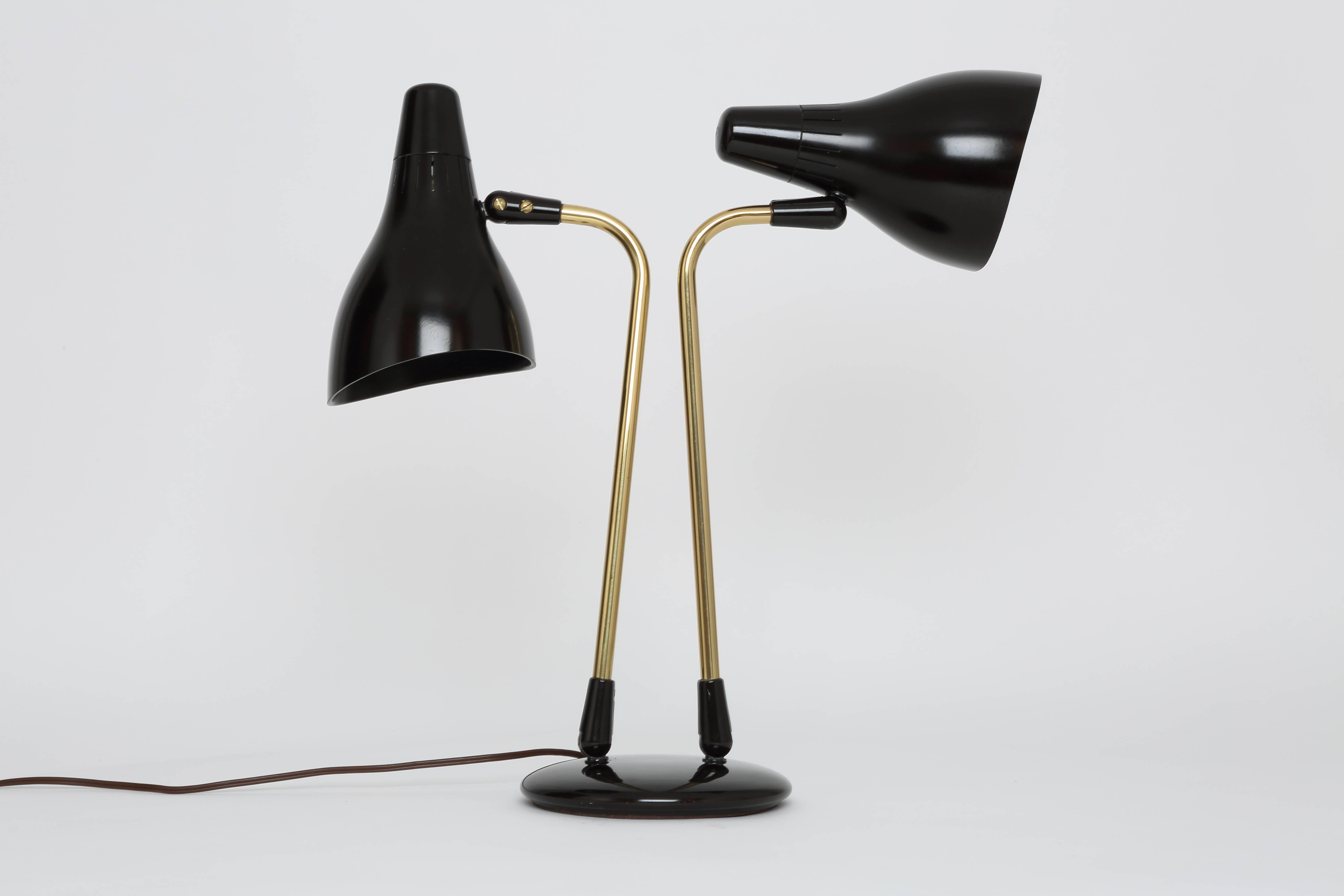 Gerald Thurston desk lamp for Lightolier.
Made in USA in 1950s.
Plastic and brass.
