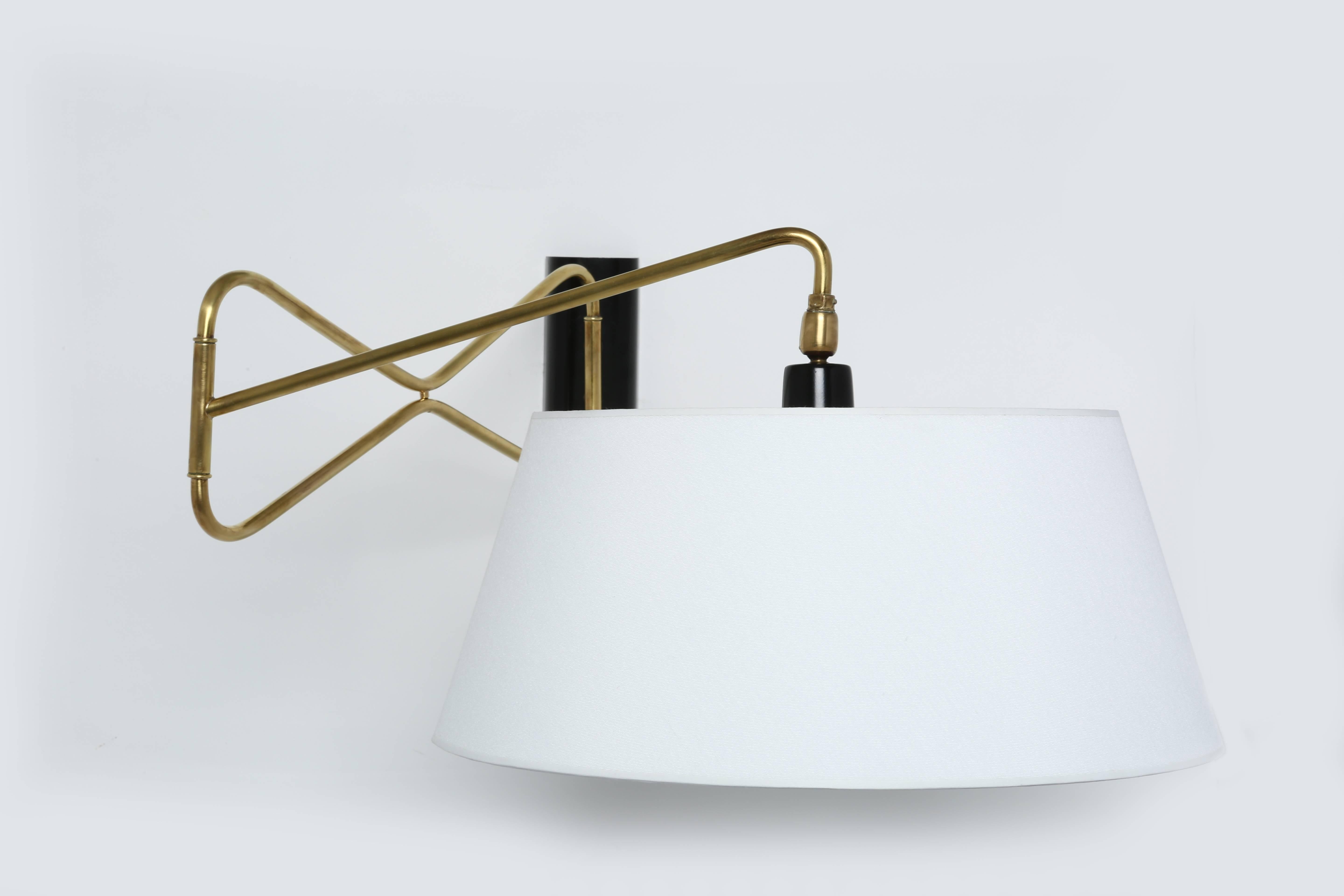 Wall lamp by Lunel.
Wall lamp can swing at the base and fold in half.
Shade can swivel.