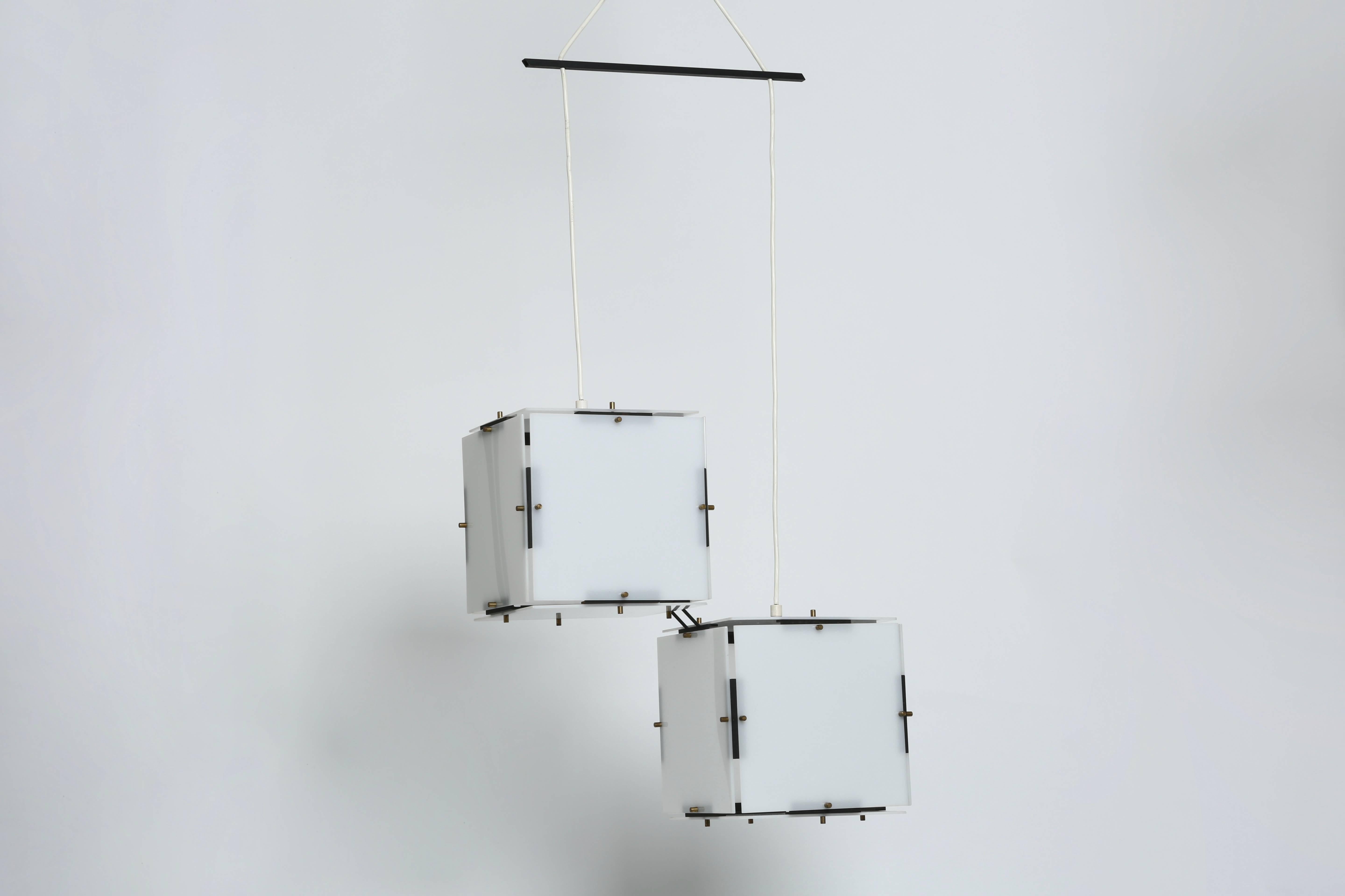 Ceiling pendant by Stilux.
Unusual minimalistic pendant made out of plexiglass squares.
Consists of two connected cubes,
Italy 1960s.