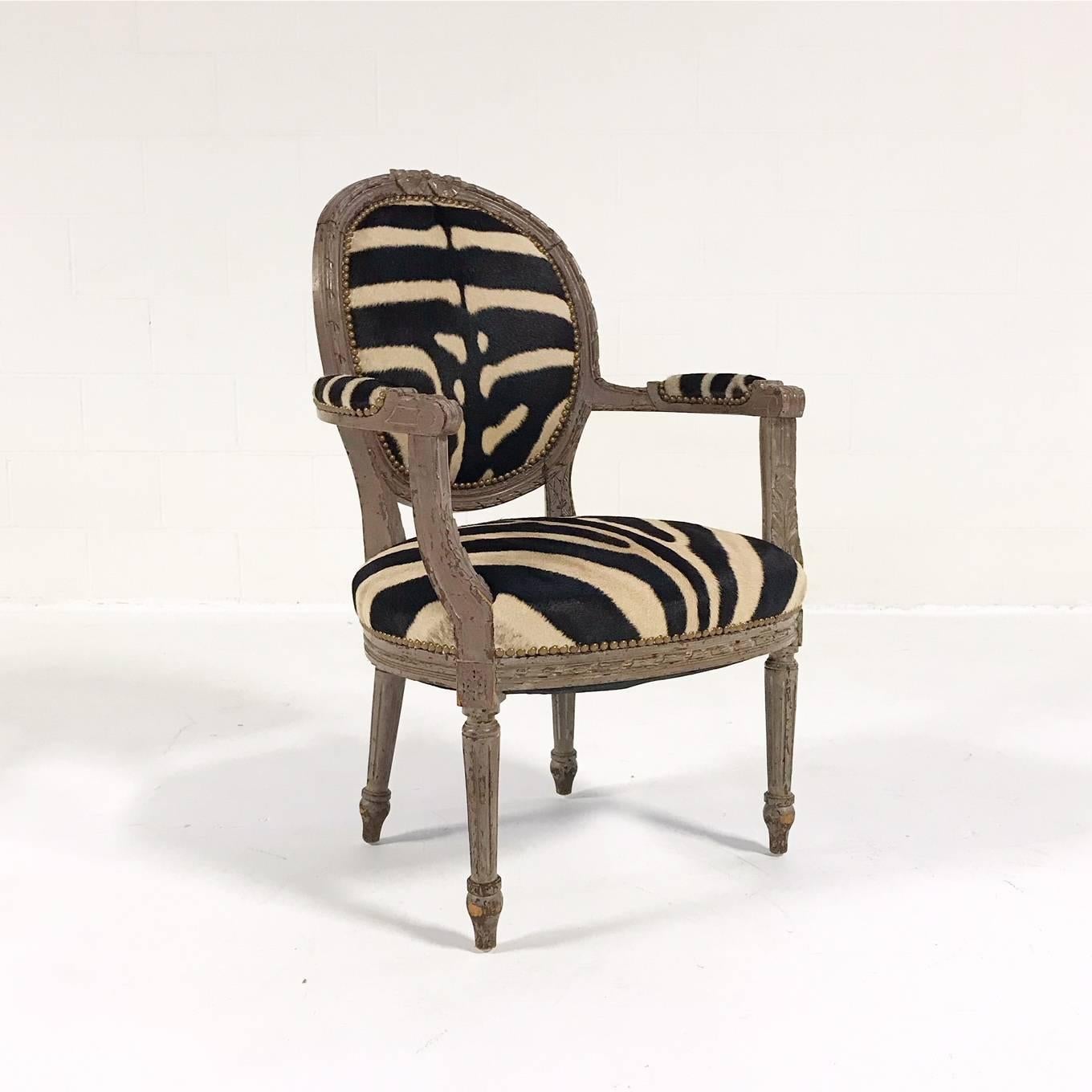 An elegant Louis XVI style armchair. Newly upholstered in zebra hide by Forsyth master upholsterers, this chair is the perfect accent in any room.

Measures: 25in W x 21in D x 37in H x 17in SH 

The art of one of a kind furniture- Forsyth