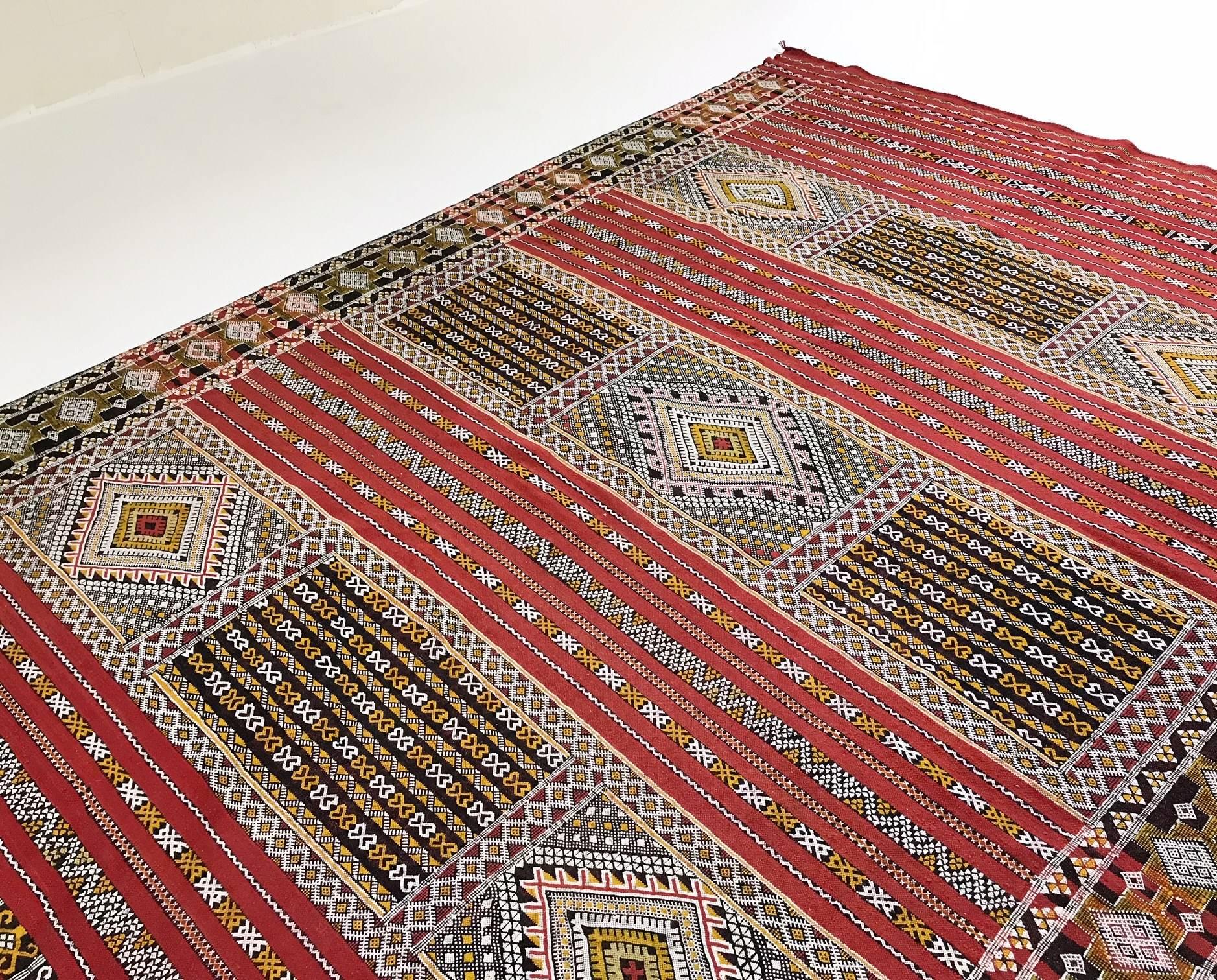 We collected this gorgeous Kilim rug from the market in Morocco! We are in love with the intricate designs and bold color. Perfect for the Bohemian inspired living room, bedroom, or den. Would be stunning as a bed cover too. Measures:  7.6″ × 11.6″.