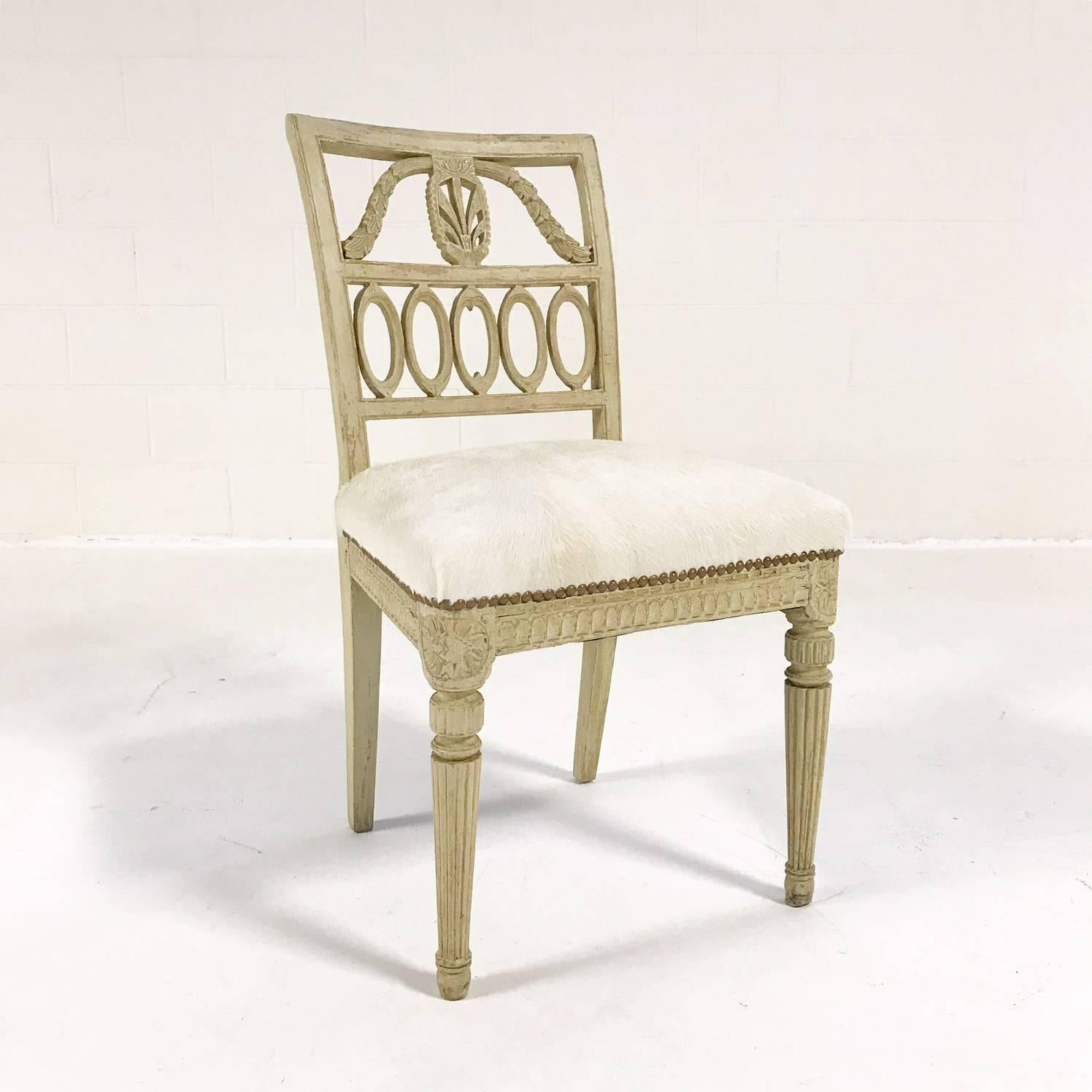 Breathtaking. These Swedish painted side chairs are just breathtaking. Chairs that are almost 300 years old and they still look beautiful today and tomorrow and everlasting. We chose the most buttery soft ivory Brazilian cowhide we could find for