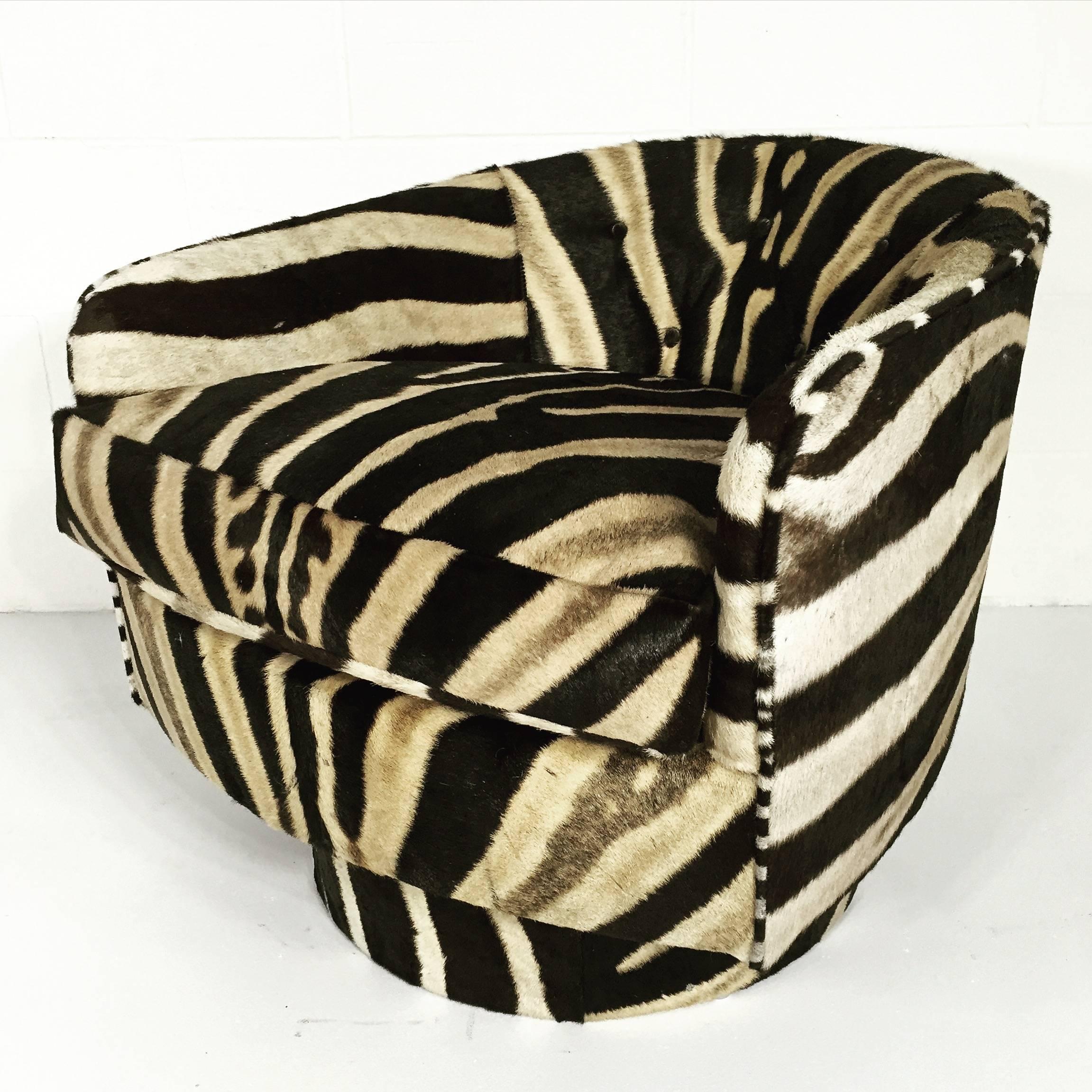 These chairs should be the star of a MOMA exhibition! Milo Baughman’s designs were original, architectural and Classic. A matching pair of Baughman swivel chairs is a rare statement; the zebra hide brings them into a whole new design stratosphere.