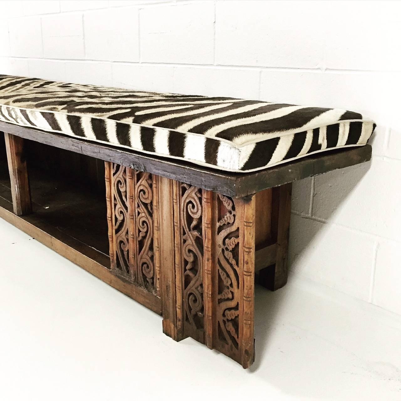 We salvaged the base of a Chinese work table and added new wooden slabs to make the top of this large ornately carved bench. The wide seat is perfect for a beautiful hallway catching kids, and dogs, and boots, and things. Or at the foot of a bed