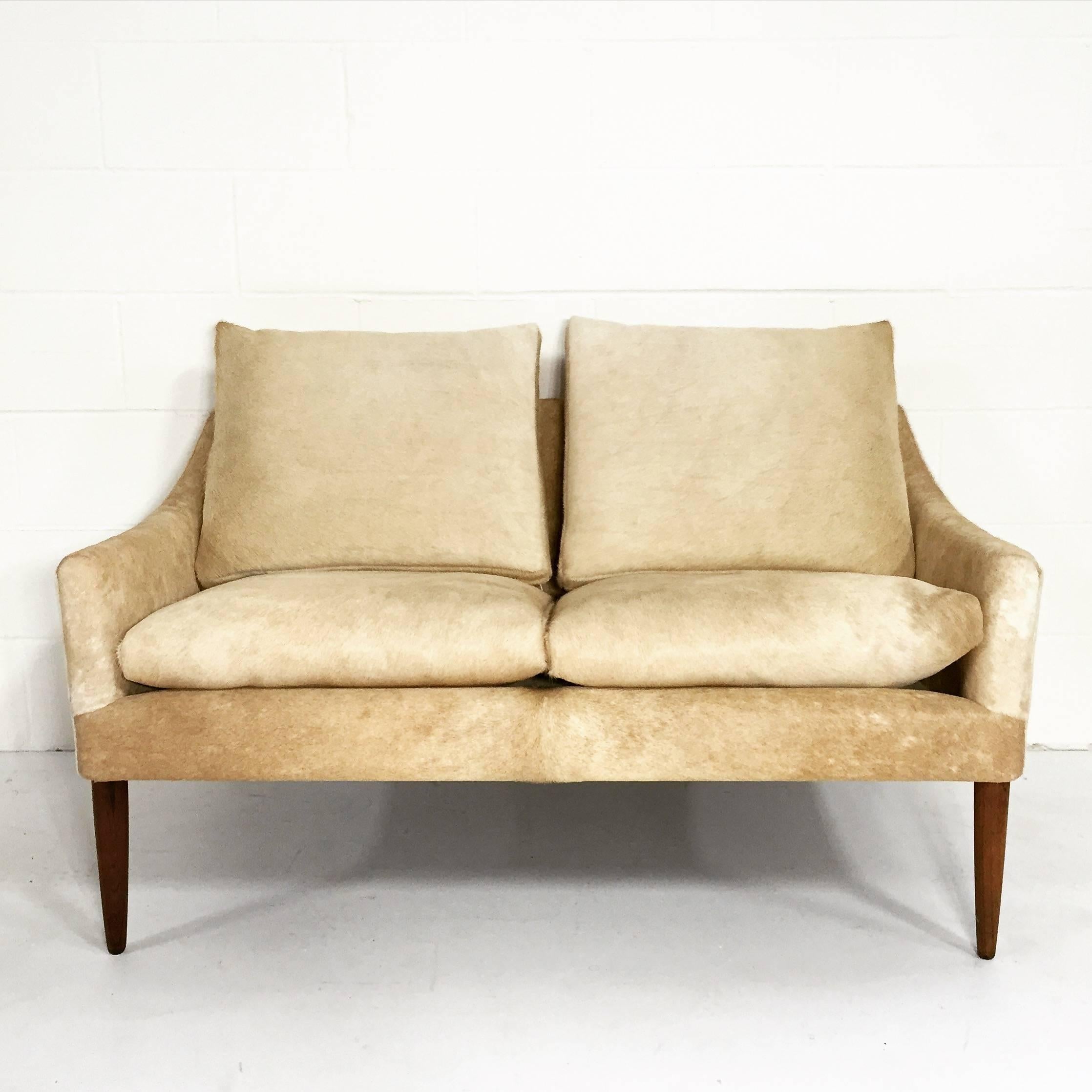 You have to admire every graceful line of this Danish design. We adore this piece! It’s a mastery of upholstery. We chose the silkiest palomino cowhides and they couldn’t be more perfect. This is destined for an amazing home.

Pair available.