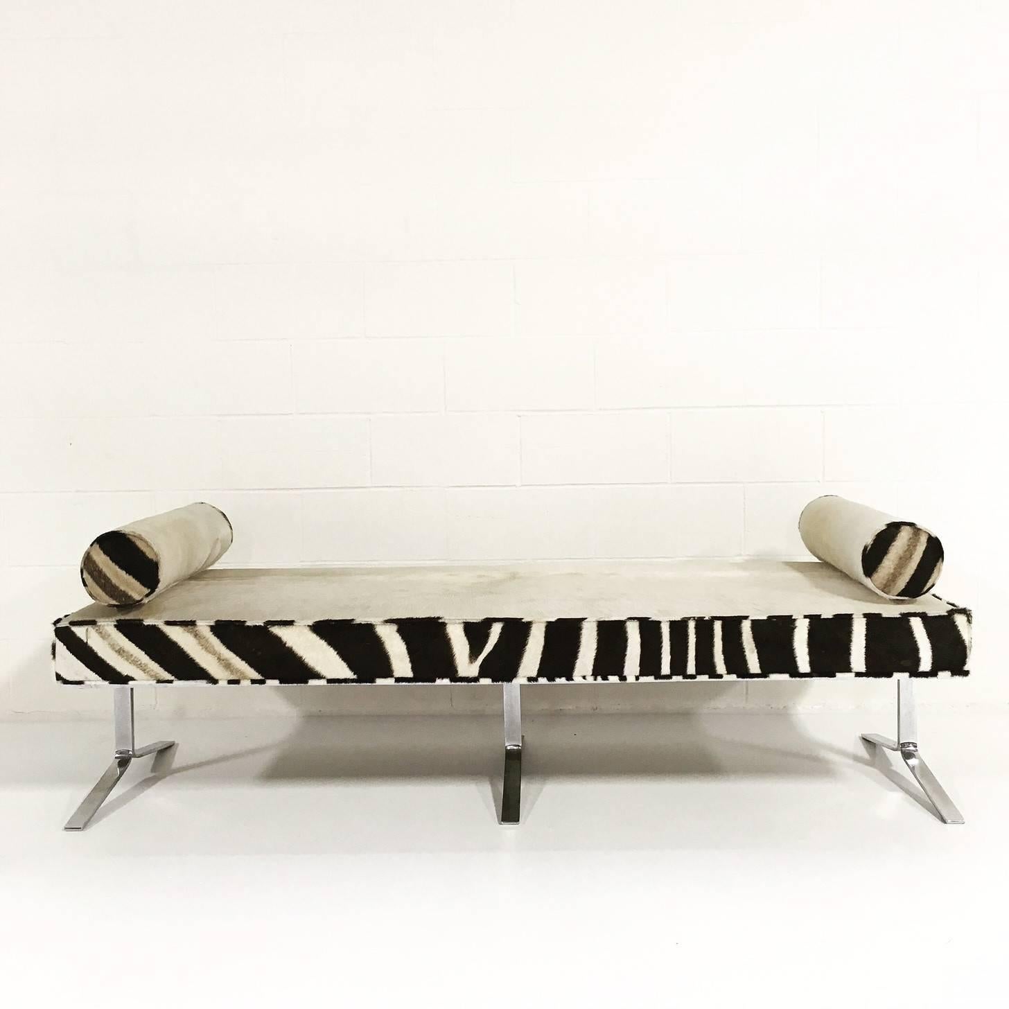 We keep picturing this amazing bench at the end of a beautiful bed. Ivory cowhide and zebra hide pair so well together. With the hint of slick chrome on the three base legs, this bench becomes a crazy beautiful work of modern art. A pair of