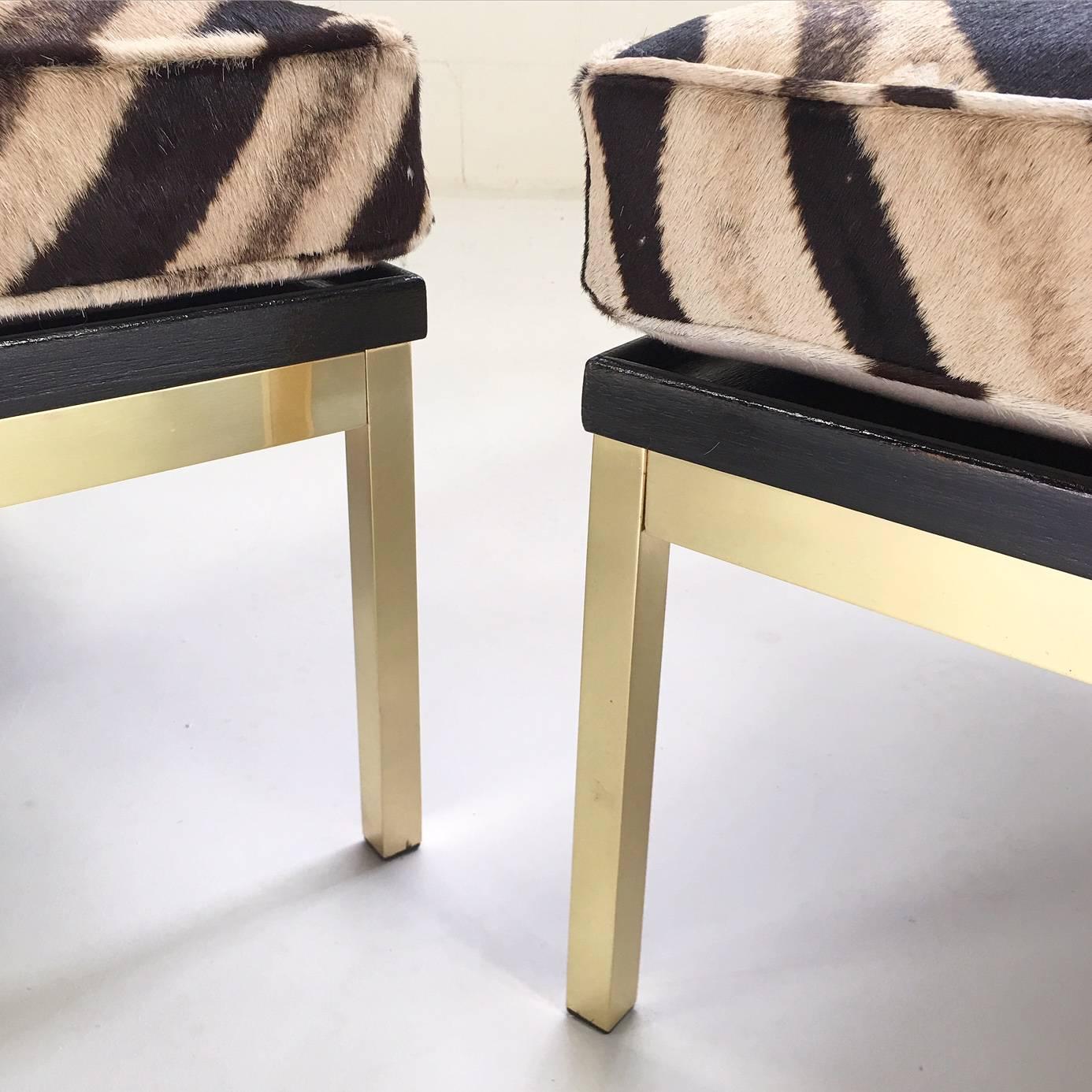 20th Century Pair of Knoll Style Zebra Hide and Brass Ottomans