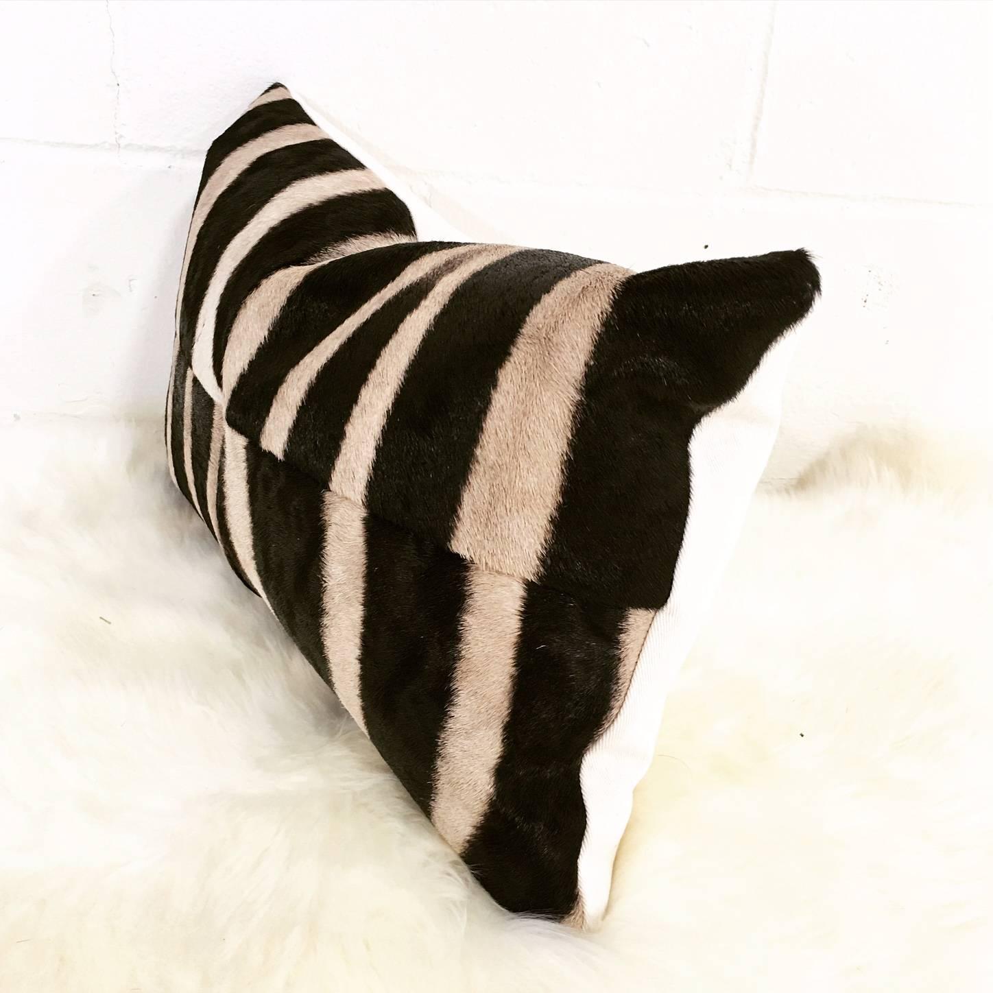 Forsyth zebra hide pillows are simply the best. The most beautiful hides are selected and hand-cut, hand-stitched and hand stuffed with the finest goose down. Each step is meticulously curated by Saint Louis based Forsyth artisans. Every pillow is a