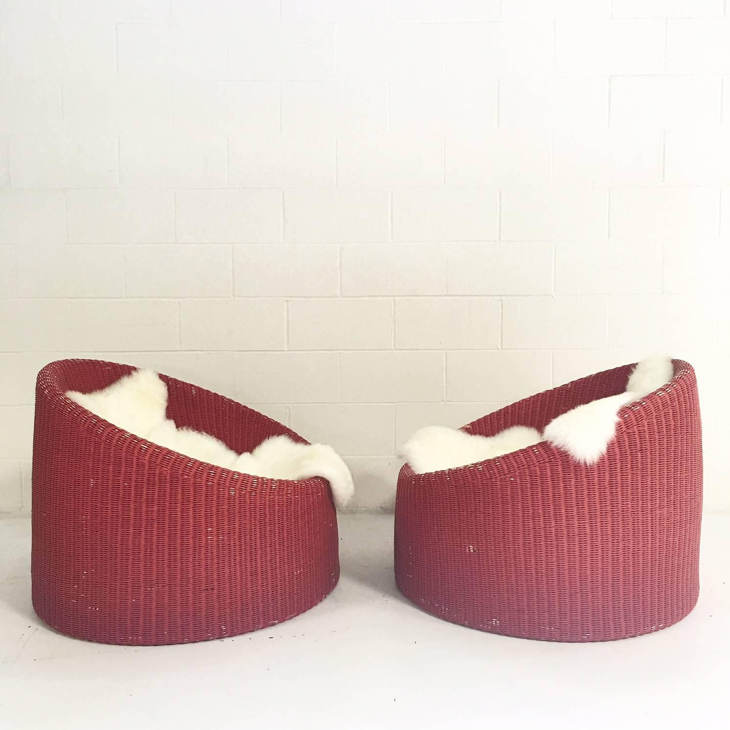 Scandinavian Modern Pair of Eero Aarnio for Stendig Woven Rattan Lounge Chairs with Sheepskin Throws
