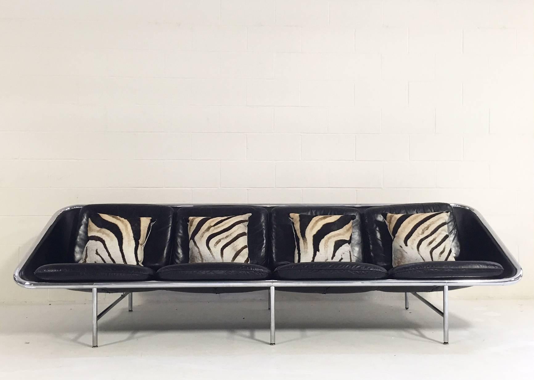 An exceptional piece of Mid-Century design. We fell in love with the exquisite lines of this Model 6833 Leather Sling Sofa by George Nelson for Herman Miller. We added four of our beautifully handcrafted zebra hide pillows for texture and pattern.