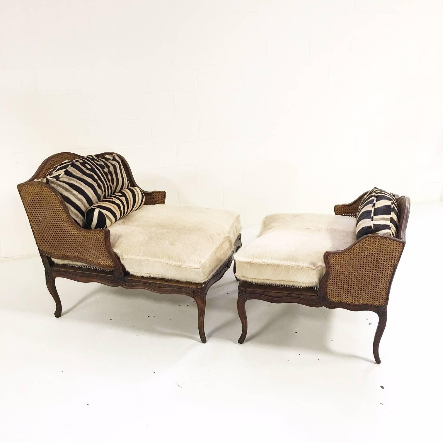 This dramatic and beautiful two-piece caned daybed looks as though it once had a home in Karen Blixen’s Kenyan farmhouse. We handcrafted custom cowhide and zebra hide cushions and pillows. We hand selected the perfect hides for the custom zebra and