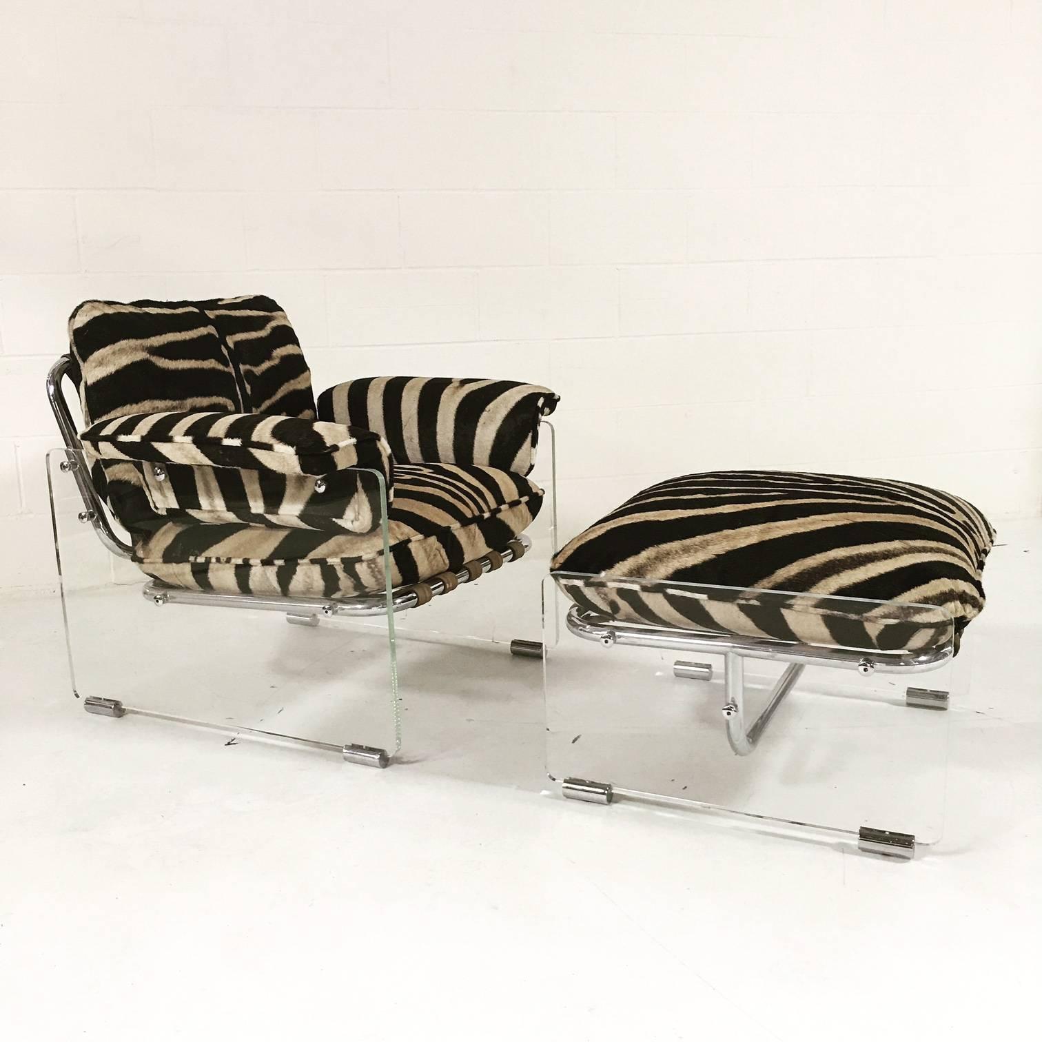 This amazing one of a kind 1970s Pace collection lounge chair and ottoman features thick Lucite panels with chrome details. Suede and wool straps wrap the tubular chrome frame to support the cushions. The loose cushions have been masterfully
