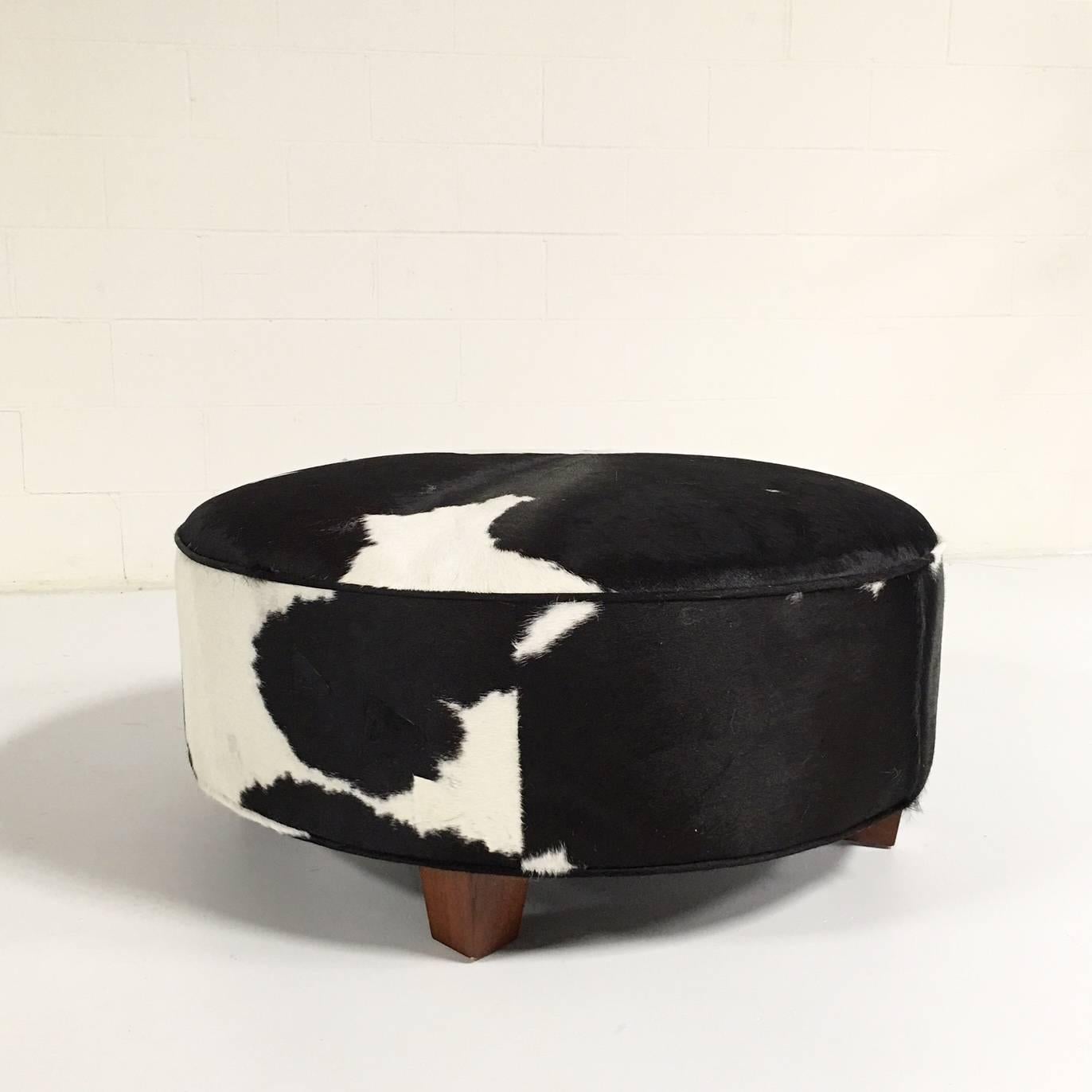 We love the size of this ottoman - it’s big enough for your feet to share with a polished silver tray and a stack of art books. And nothing is more classic than black and white.

Diameter: 38.5 inches.
Height: 15 inches.

The making of this