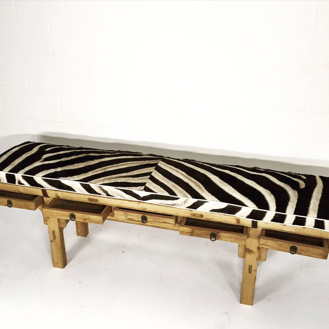 This very cool bench, over 70 years old from the Zhegiang Province, was originally a tall table used to store a calligrapher’s tools. We shortened the legs and designed the custom zebra cushion to compliment the beautiful wood.

 

Length: 68