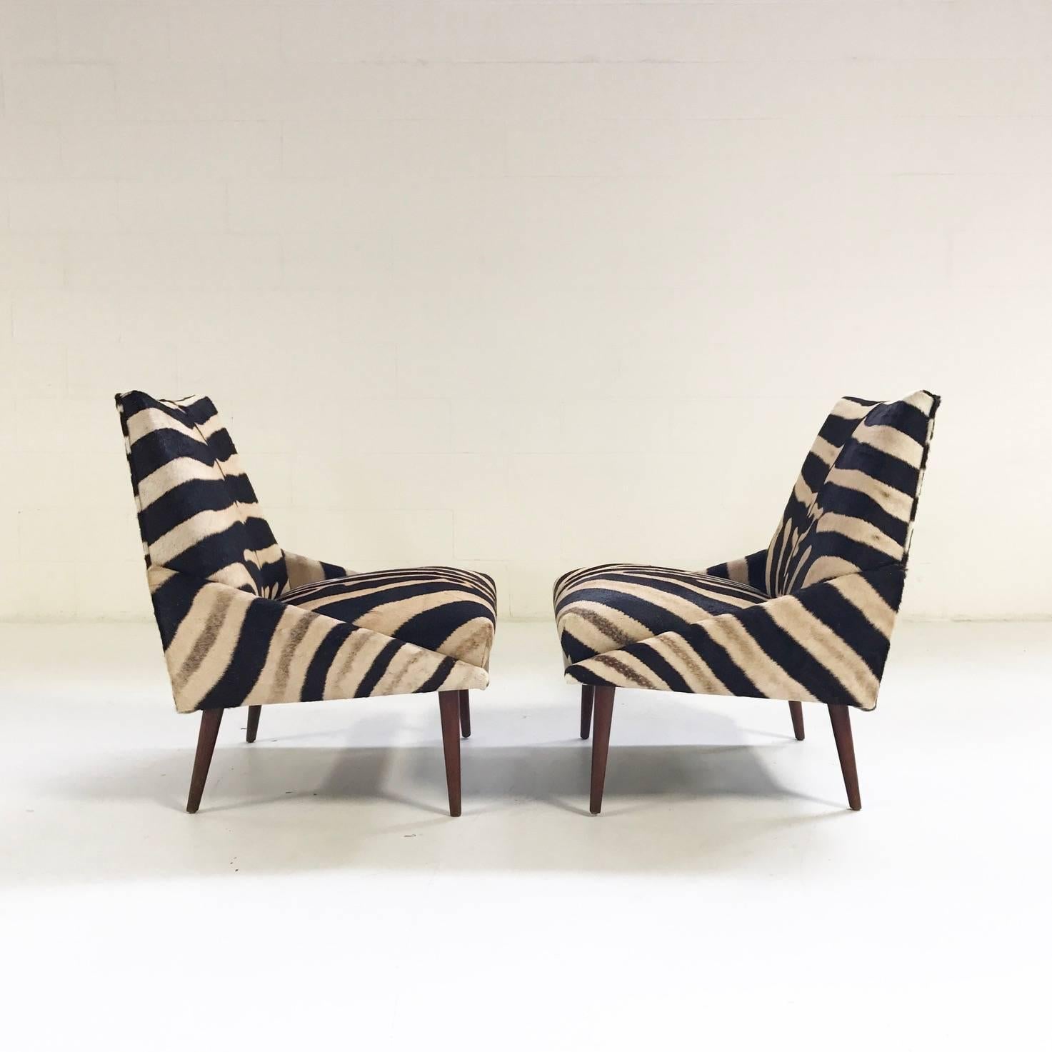 This stellar pair of chairs were designed in the manner of renowned Mid-Century Modern designer, Adrian Pearsall. They underwent a reconditioning and restoring process for which Forsyth is known the world over. Reupholstering in our one of a kind