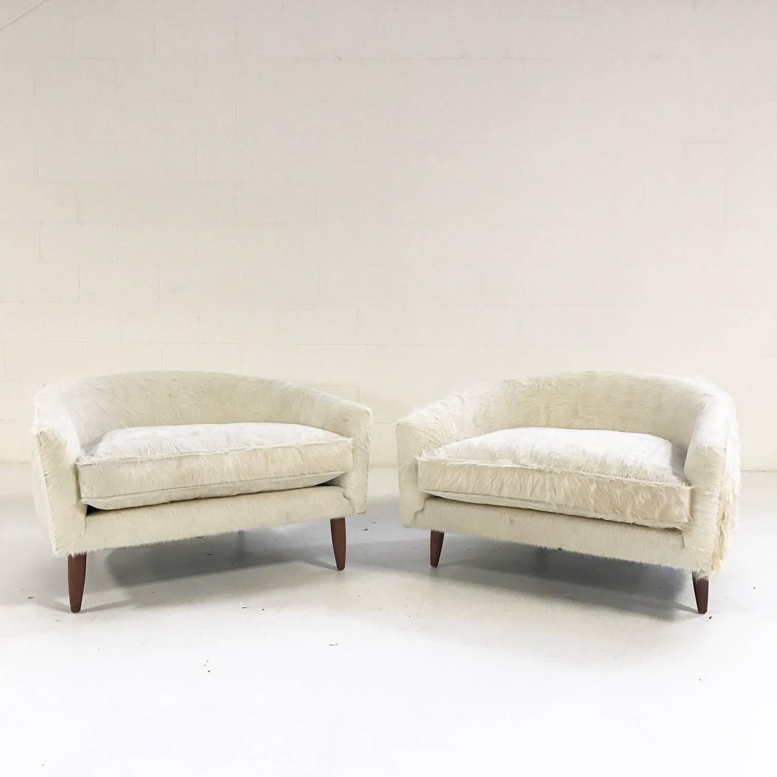 Lightning struck when we acquired this very rare pair of cloud chairs. We knew exactly what they needed - our luxuriously soft, silky ivory Brazilian cowhide. We love the wide and low profile, a superb example of Pearsall's vivacious, swinging 60s