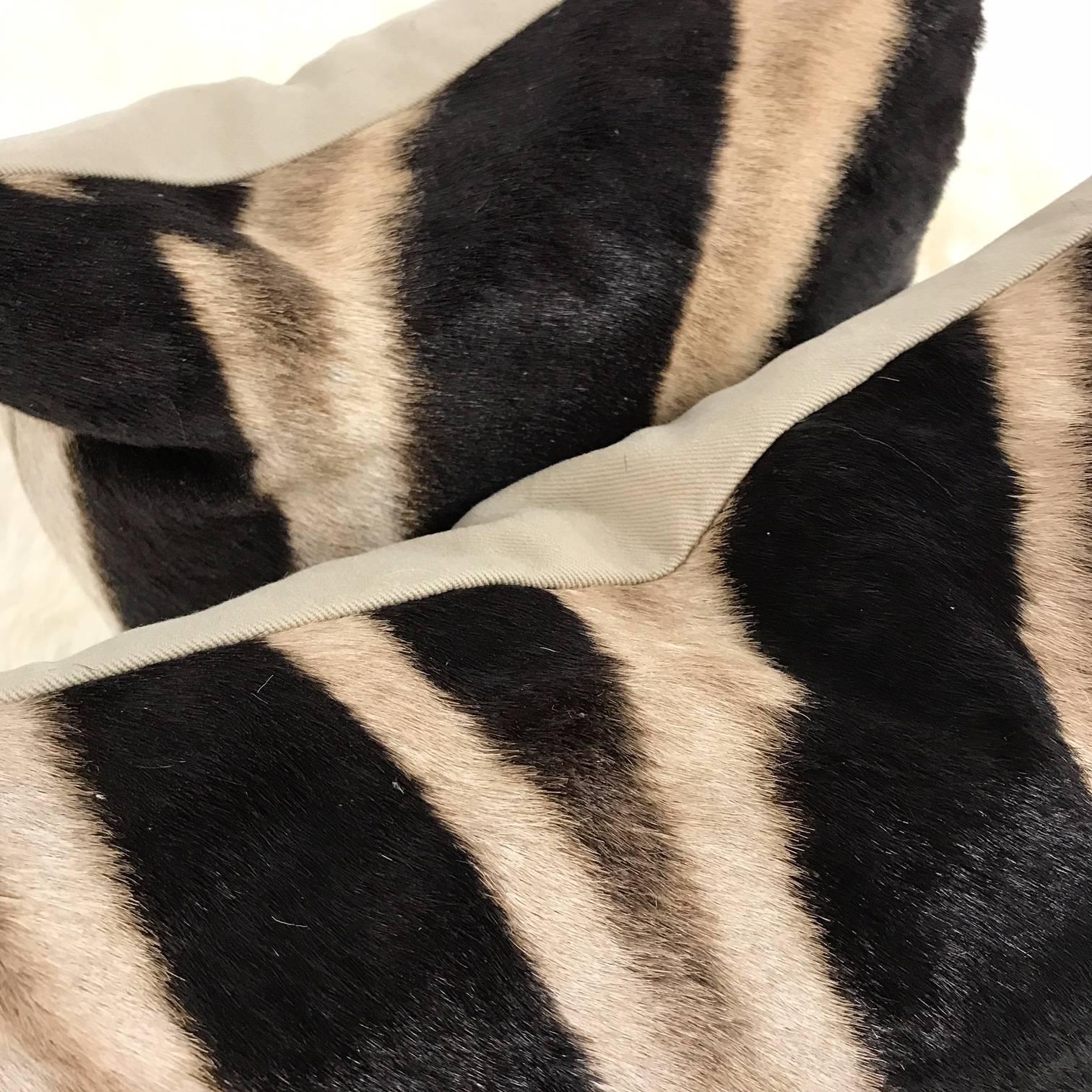 Forsyth zebra hide pillows are simply the best. The most beautiful hides are selected and hand cut, hand-stitched and hand stuffed with the finest goose down. Each step is meticulously curated by Saint Louis based Forsyth artisans. Every pillow is a